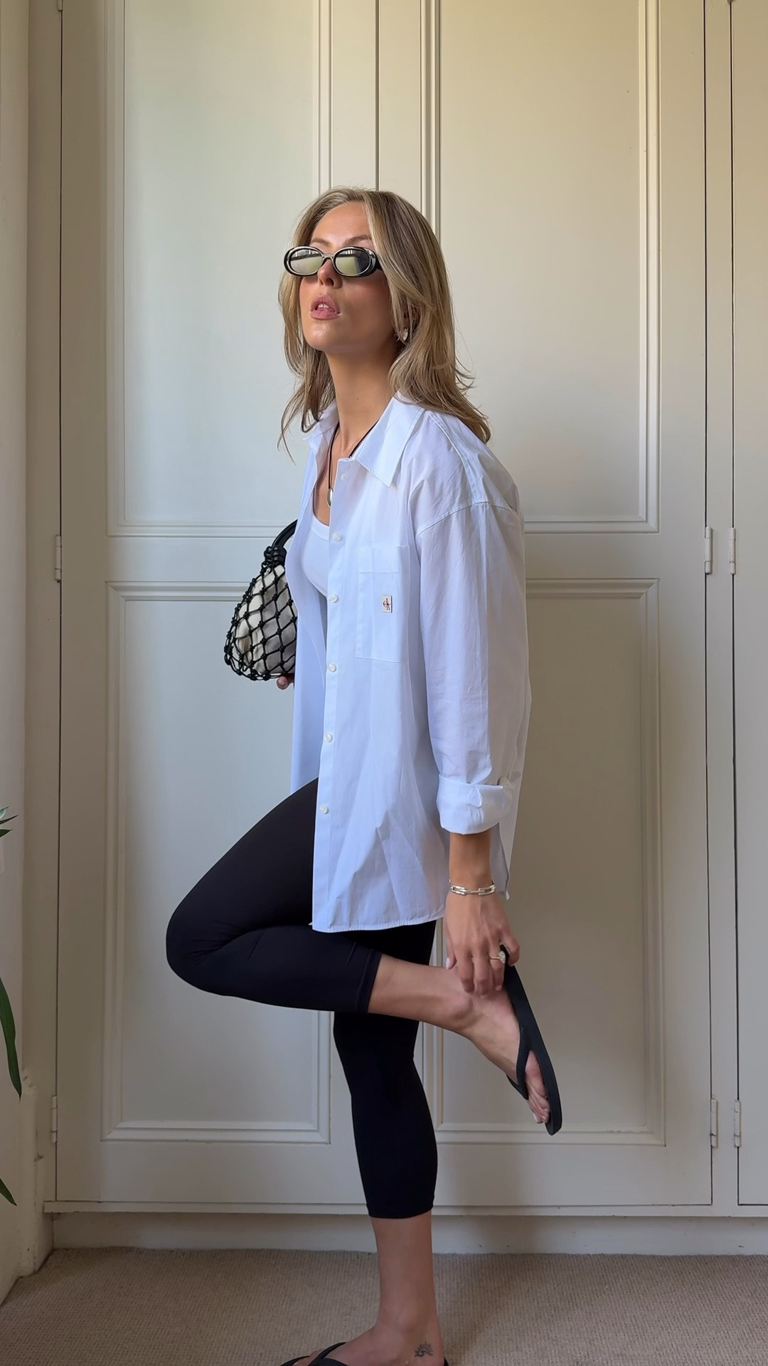 A monochrome off-duty spring outfit 🖤🤍

White shirt, cotton poplin shirt, oversized shirt, capri pants, capri leggings, 3/4 black leggings, white tank top, ribbed cotton vest, black flip flops, havianas, macrame bag, woven bag, summer bag, statement bag, cord necklace, simple spring outfit, black and white

#LTKuk #LTKspring #LTKsummer