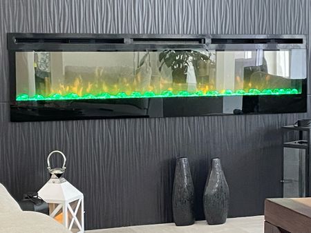Beautiful electric fireplace there are several options of colors that you can choose to display or you can choose the color to be constantly changing. Great living room decor 

#LTKhome #LTKFind #LTKfamily