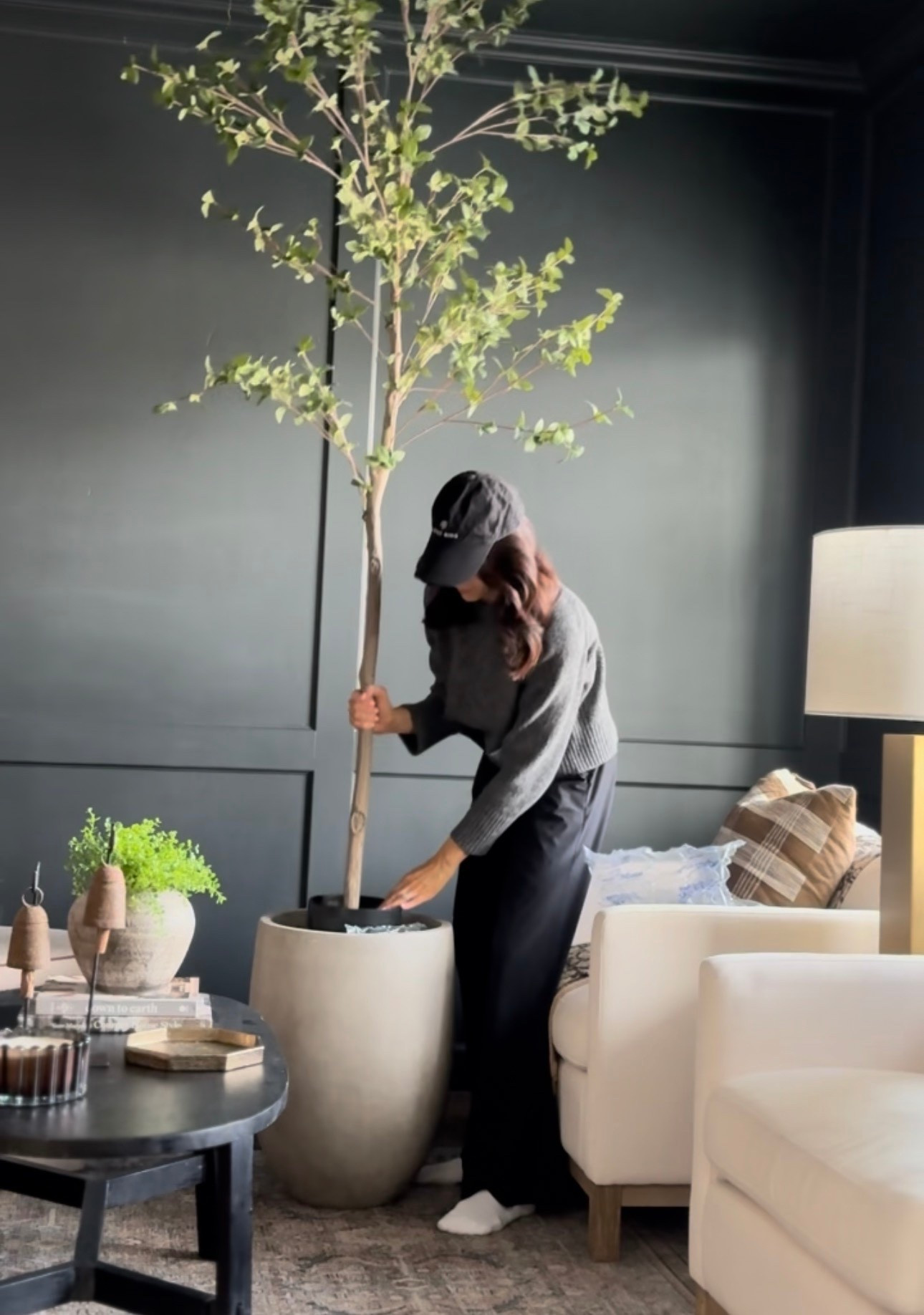 If you’re just setting a faux tree out in the tiny plastic pot it came in, you’re missing the magic.
The secret?
✨ Repot it into a larger, more realistic planter
✨ Fill the planter so the tree sits higher and feels grounded
✨ Use anything on hand—brown paper, bubble wrap, even boxes
✨ Finish it off with moss on top for that real-plant look
That simple switch instantly elevates your faux plants and makes them look so much more believable. No maintenance, no stress… just good design.


#LTKSeasonal #LTKHome