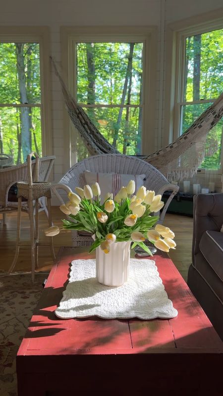 Current porch vibes. I walked by the porch this morning and couldn’t help but notice how pretty the tulips looked as the summer morning sun came through the screen porch windows. The flower vase is vintage. There are 42 tulip stems in this vase 😉  
kimbentley, home decor, tulips, wedding decorr

#LTKSeasonal #LTKVideo #LTKFindsUnder50