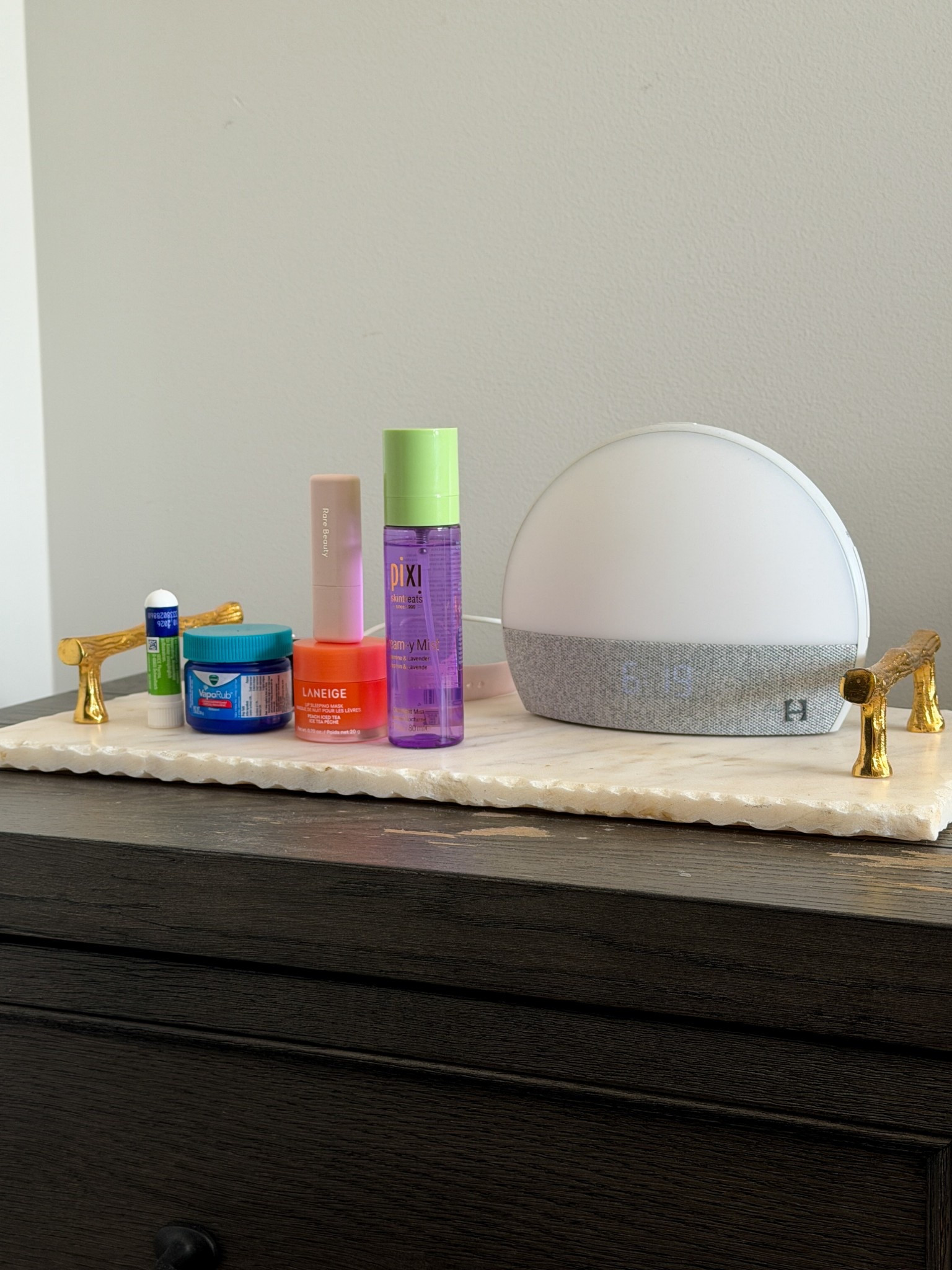 Nightstand refresh ☁️ A few essentials lined up like a lavender jasmine pillow spray and facial mist, lip sleeping mask, lip butter, and my sunrise alarm  

#LTKHome #LTKBeauty #LTKselfcare