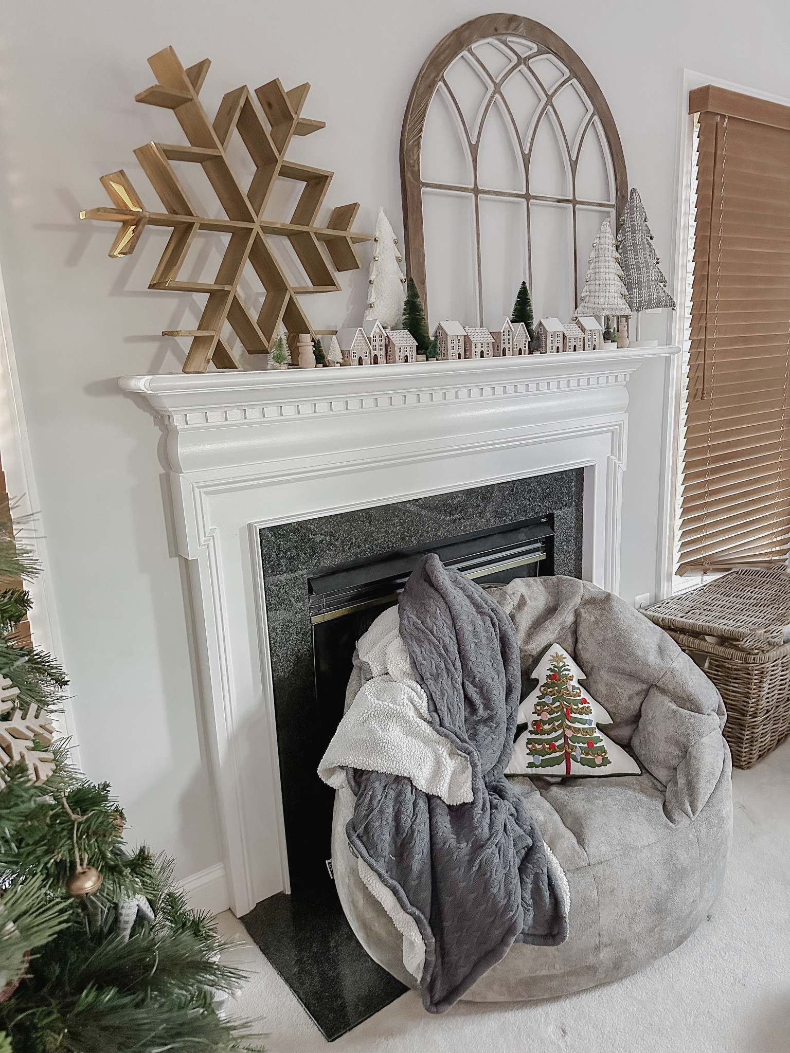 Christmas villages will always be my favorite 🤍

With a rambunctious toddler, I was worried about setting up my usual garland on my mantle - so when I saw these little houses I knew they’d be the perfect way to safely decorate this space ✨

I also really want to incorporate this snowflake piece that everyone loved last year and I just love how this turned out! 

Are you adapting how you decorate this year to accommodate littles or pets?! Kind of a fun way to challenge your styling and maybe get some new pieces 🎄


snowflake: @joanns
arch: @kirklands
mini houses: @target 
bottle brush trees: @target
wooden snowman: @target
tall fabric trees: @homegoods
Christmas tree pillow @target
chair: @shopbigjoe
blanket: @cariloha




#LTKSeasonal #LTKHoliday #LTKhome