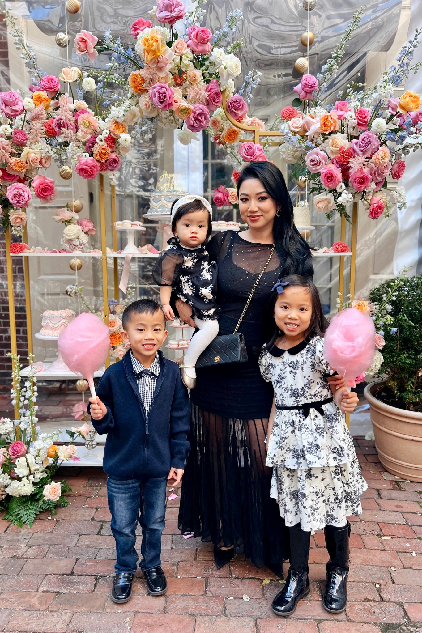 Mommy and Me Tea Party Outfits // Elegant black and white mother and daughter outfits. I’m  wearing a black sheer gold specled long sleeve bodysuit with feather cuffs and a black knit fabric sheer maxi skirt. My daughters are wearing floral black and white dresses with matching faux fur shrugs. 

#LTKHoliday #LTKfamily #LTKparties
