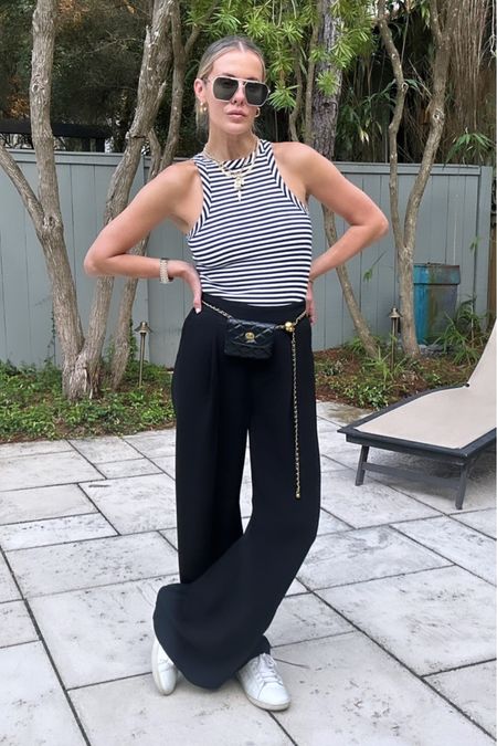 Travel outfit! I hate wearing jeans on a plane so these Spanx pants have been the ultimate comfy solution! Tank looks black and white but it’s actually navy! And this $79 necklace is back in stock! Sizing info: tank/small, pants/small, regular length, sneakers/TTS  

#LTKunder50 #LTKtravel #LTKstyletip