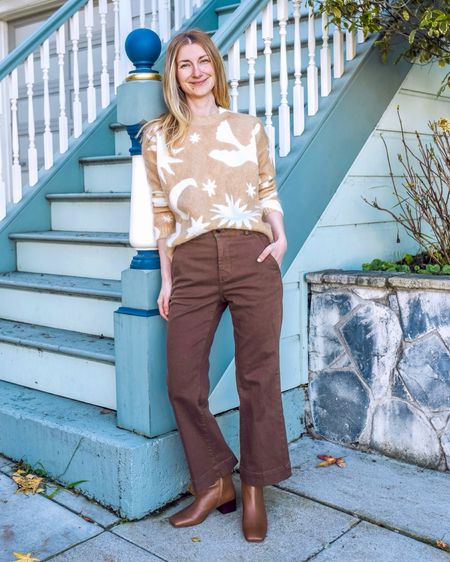 A chic timeless outfit in neutrals. A graphic sweater paired with kick flare brown pants and low heel leather booties. I can wear this every day! Pieces are easy to mix and match with other clothes 