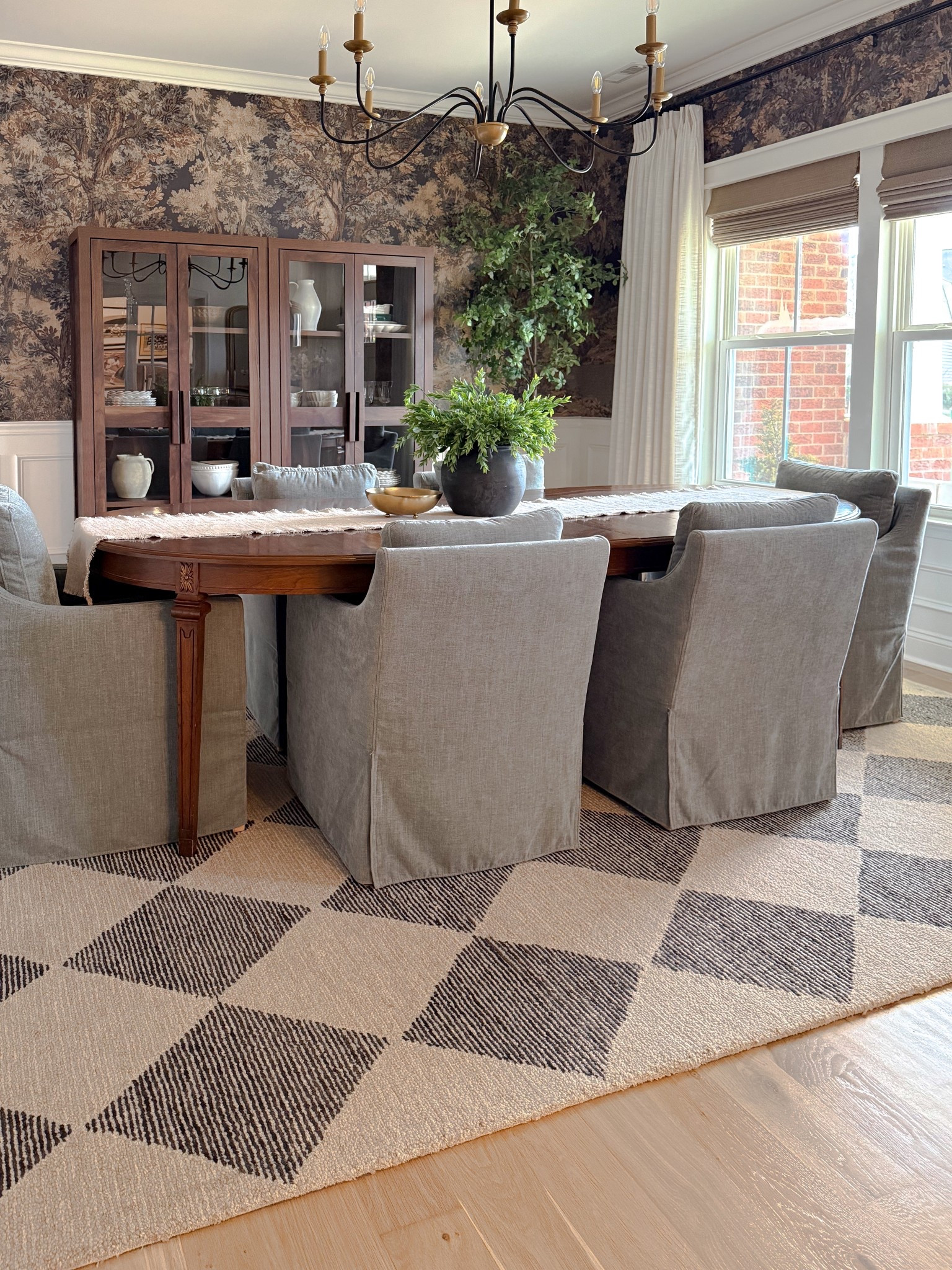 Moody yet elegant dining room, tapestry wallpaper, Loloi Rug, antique dining table, upholstered dining chairs 

#LTKdayinmylife #LTKHome #LTKSeasonal