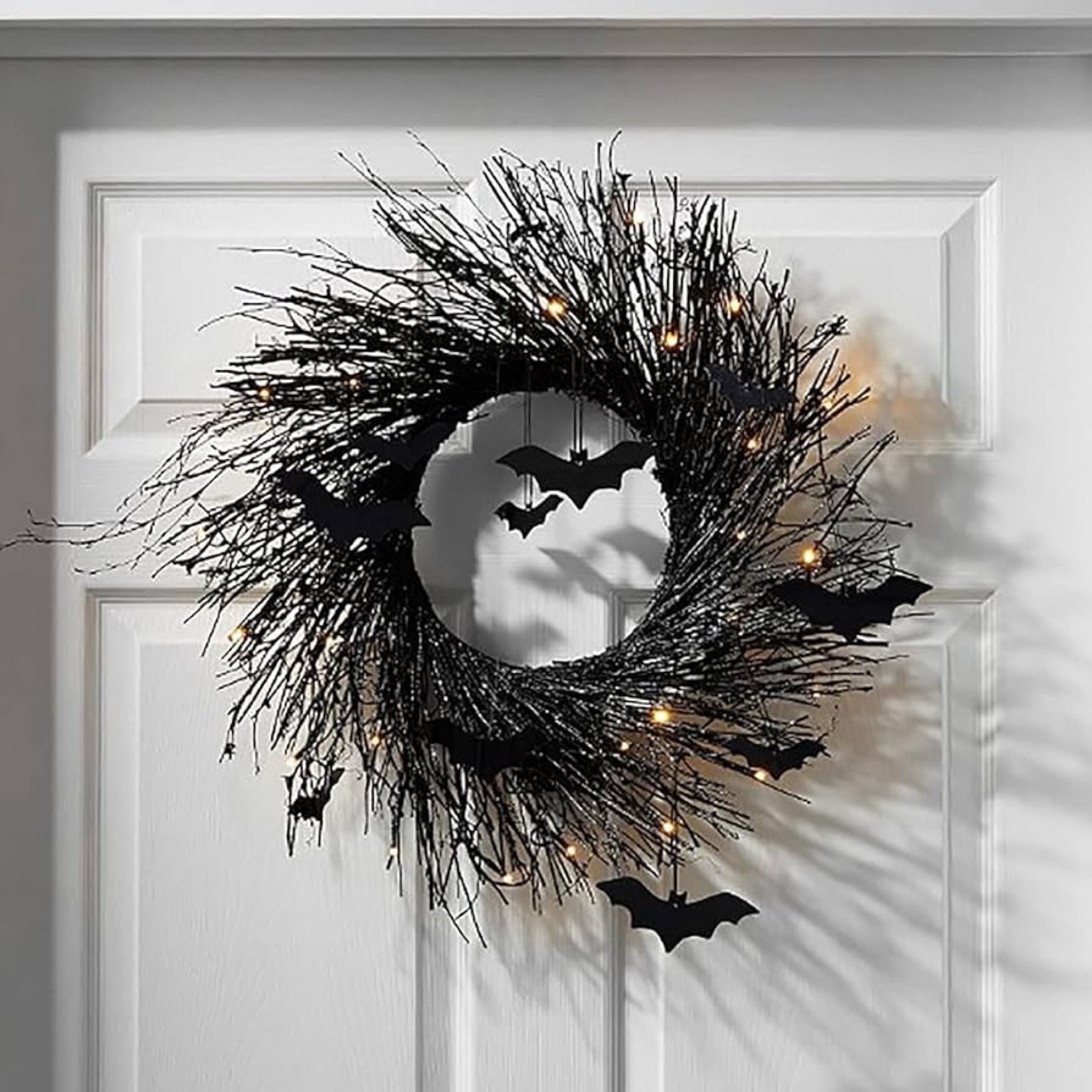 Black Halloween bat twig wreath for front door with lights. Lighted spooky Halloween wreath. 

#LTKHalloween #LTKhome #LTKSeasonal