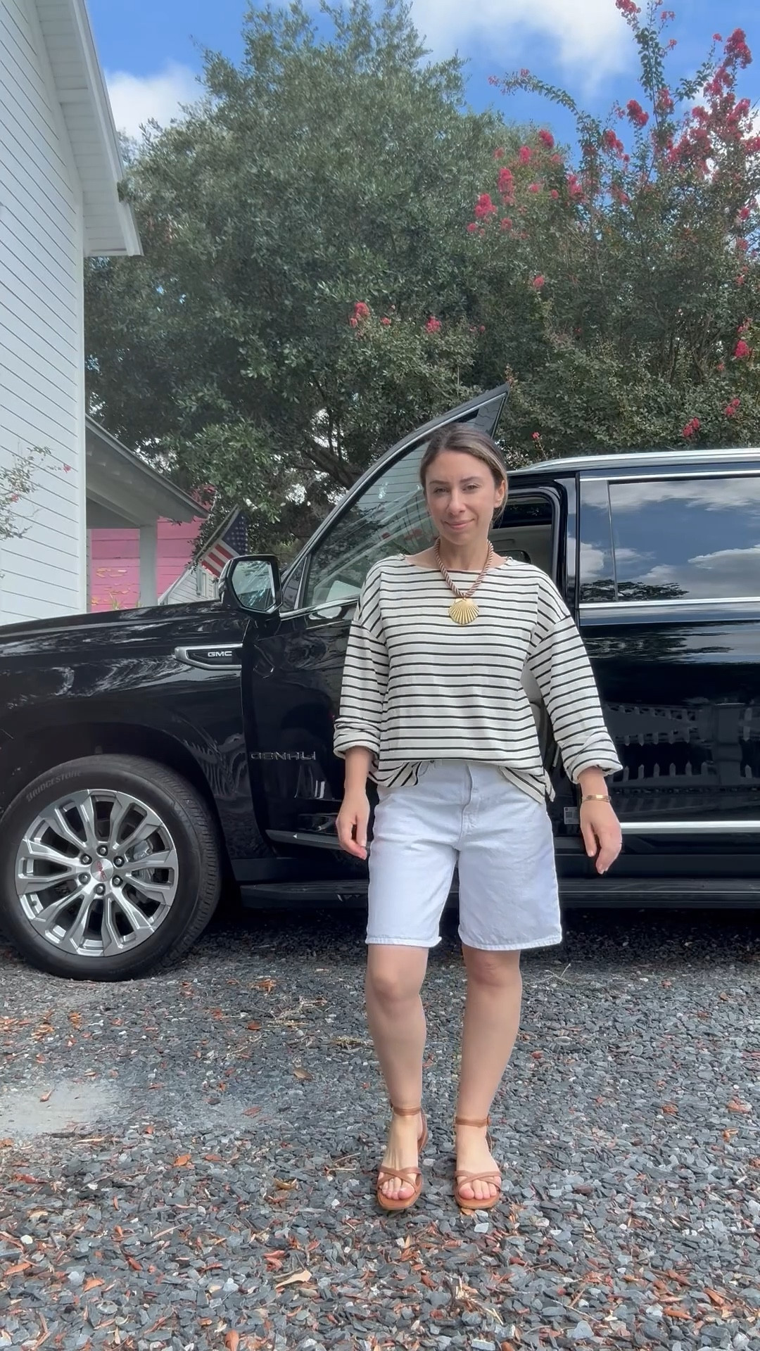 Outfit of the day in white Bermuda length denim shorts, a mariner striped long sleeve heavy knit tee, shell necklace, and favorite Margaux strappy sandals. 