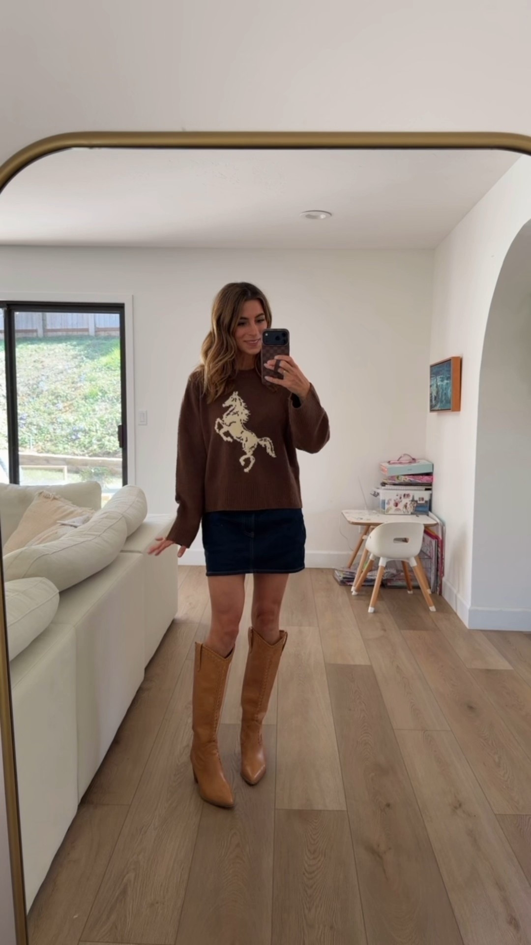 Brown sweater & dark denim 🤌 fall country vibes

Horse sweater, brown boots, tall boots, denim skirt 