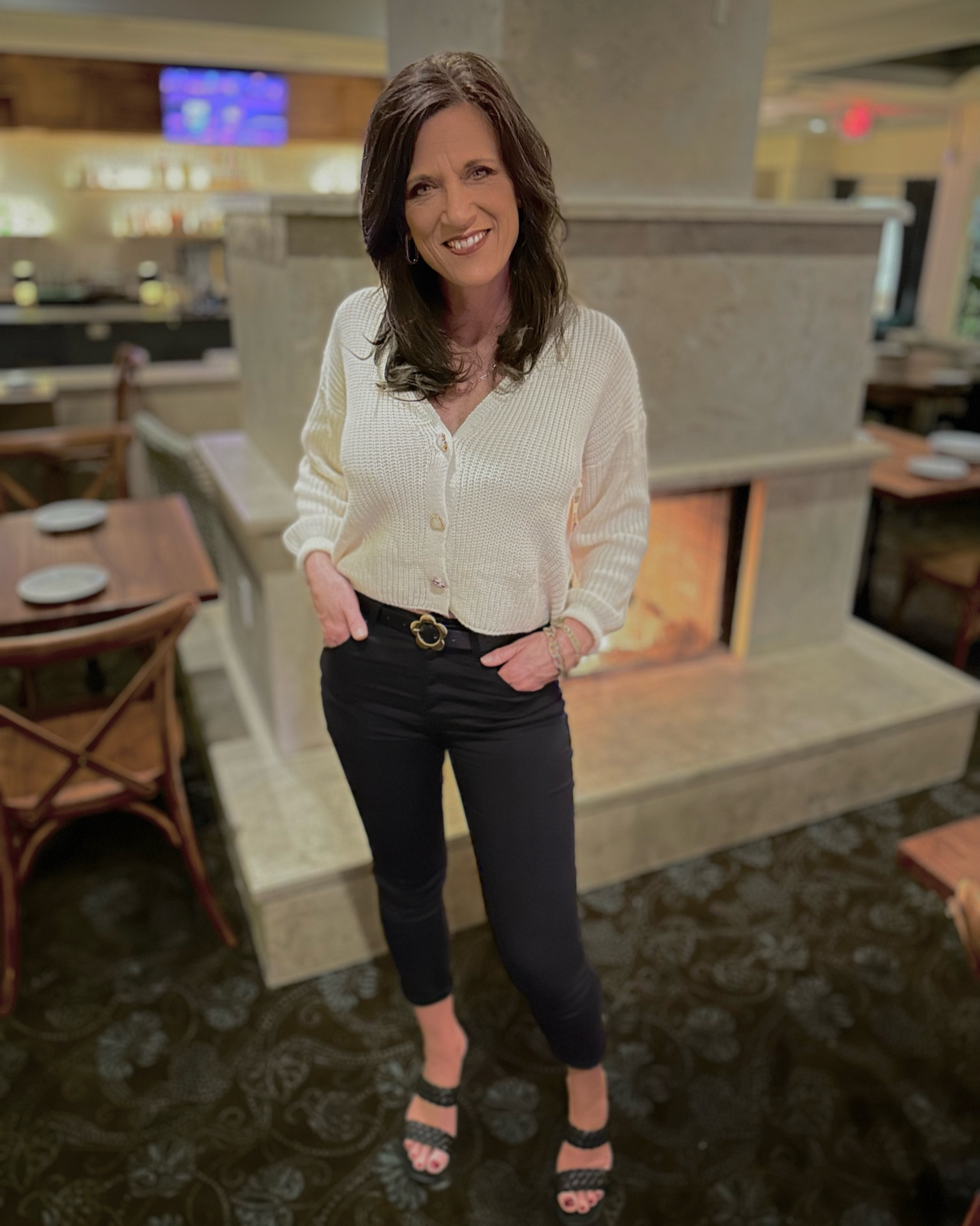 I really like this outfit, and my husband does, too.  Causal yet classy.  Nothing too tight or revealing.  Sweater is very soft and super comfortable with gold heart buttons, hint: Valentines Day.  
Jeans (dressier) Size 5 -  fit just right, very comfortable with a little bit (just enough) stretch.

Use code JANUARY20 to get 20% off any Pink Lily styles - great sale!

#LTKworkwear #LTKsalealert #LTKstyletip