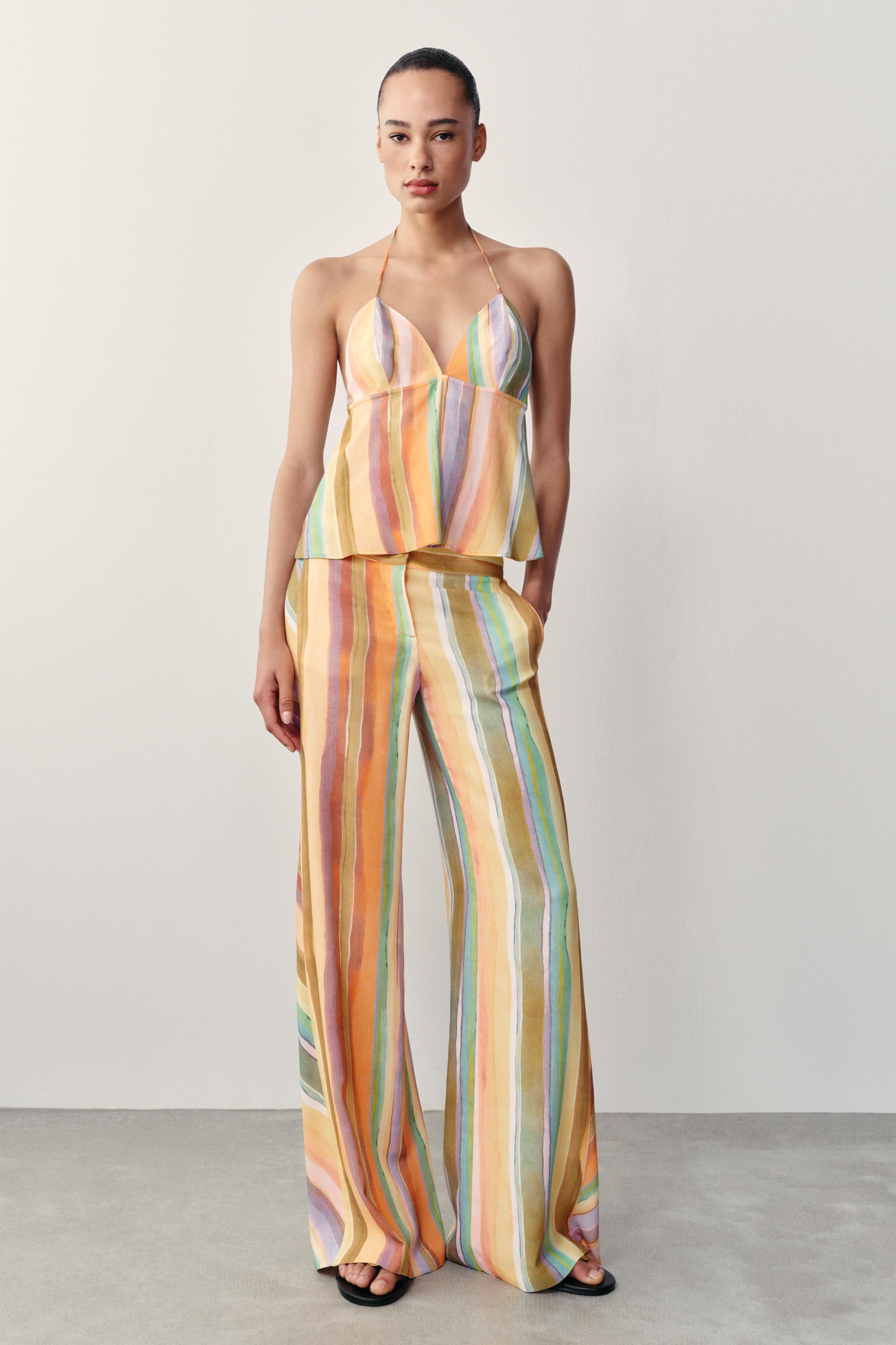 Gr\u00f6\u00dfe des Models: 179 cmHose mit mittelhohem Bund und Vordertaschen. Weites Bein. Rei\u... | Zara DE