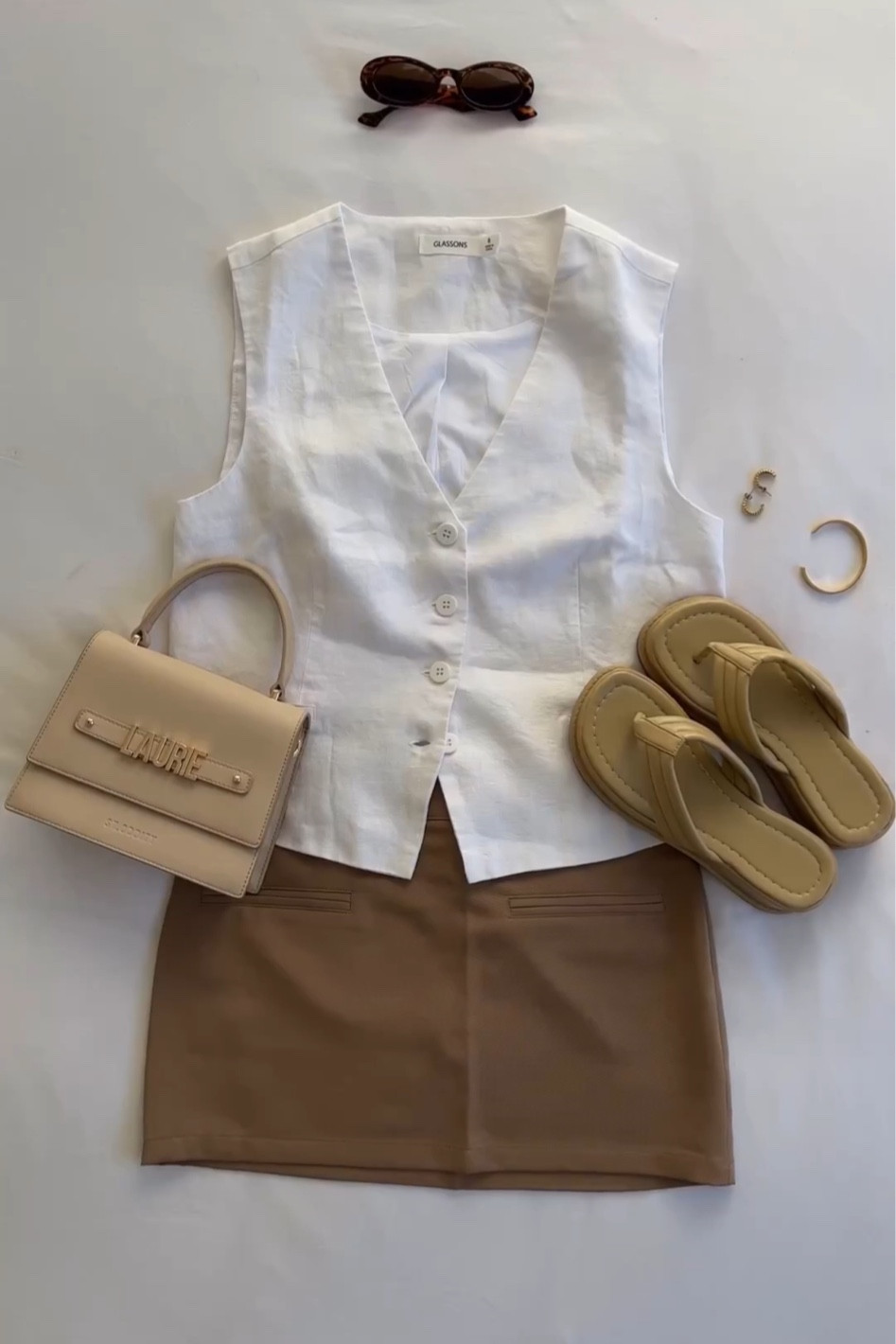 Everyday spring outfit - linen waistcoat, beige mini skirt, platform shoes
