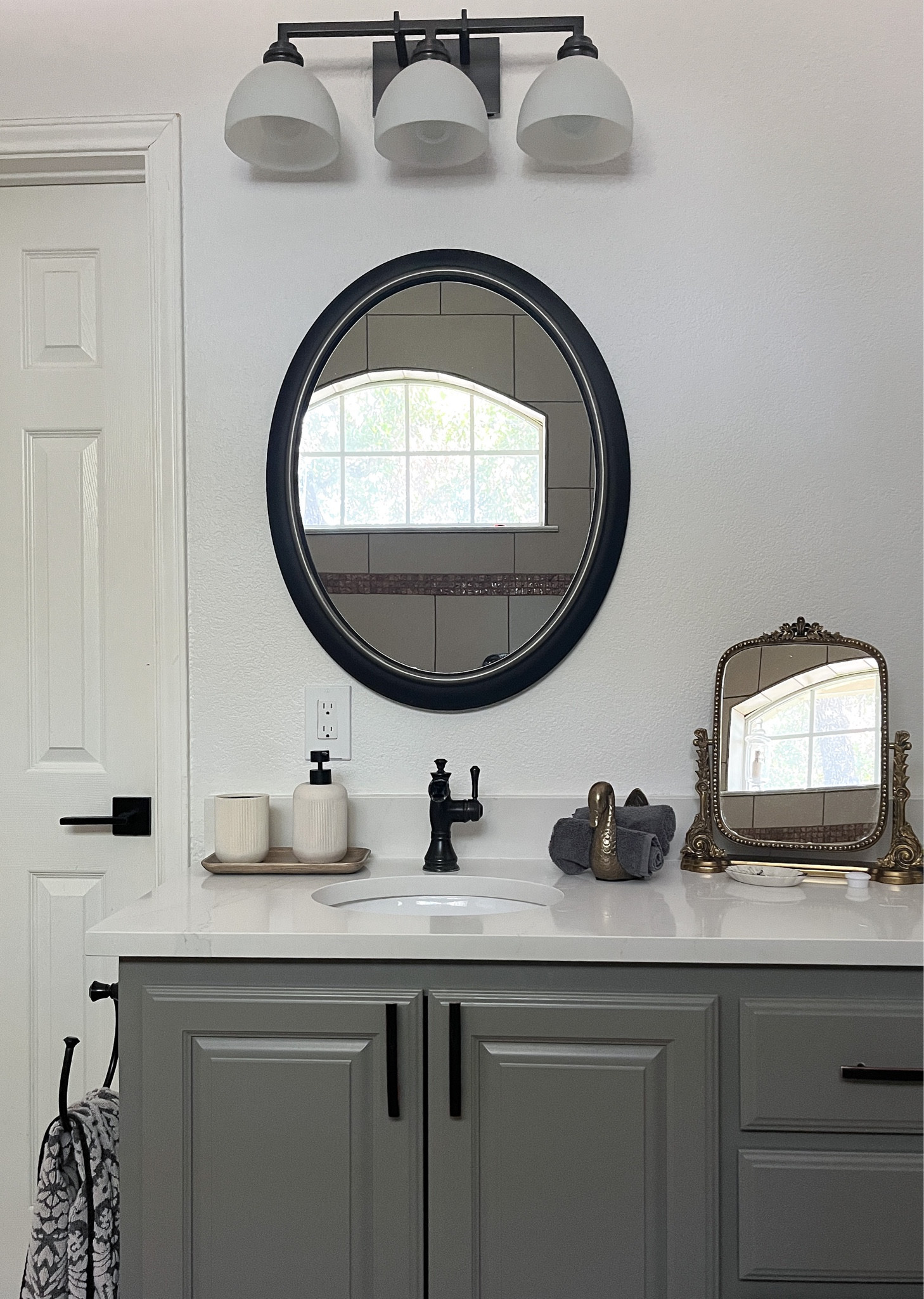 Primary bathroom decor with Anthropologie mirror towel holder and wood tray for soap dispenser 

#LTKhome #LTKstyletip #LTKFind