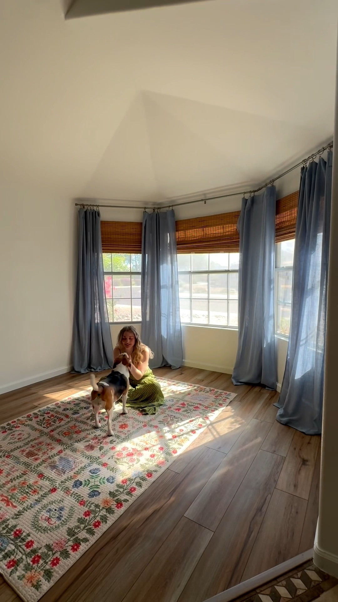sunroom makeover! this little nook off my dining room has the most beautiful natural light. it’s been a catch all space but i made it my goal this year to finally give it the life it deserves lol 

rust red velvet sofa. floral rug. blue curtains. living room decor. sun room

#LTKSeasonal #LTKHome #LTKdayinmylife