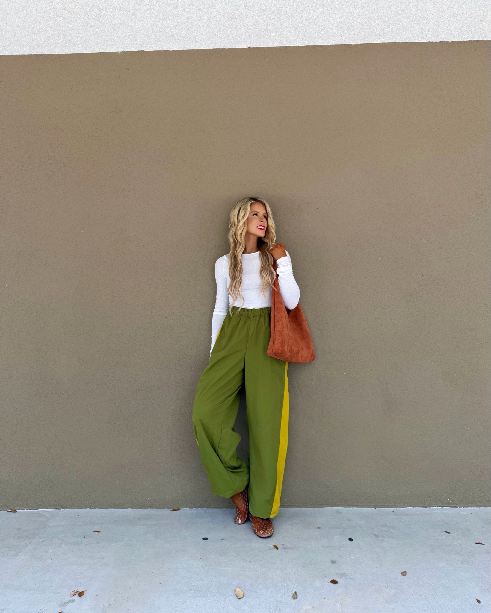 Trendy casual fall outfit styled with olive green barrel track pants, a brown suede bag, + jelly flats. The barrel pants have a matching windbreaker so it can be styled as a matching set. 

casual outfit, fall fashion trends, petite fall outfit, barrel pants, fall pants, travel outfit, athleisurewear 

@Steve Madden US @macys

#LTKootd #LTKPetite #LTKActive