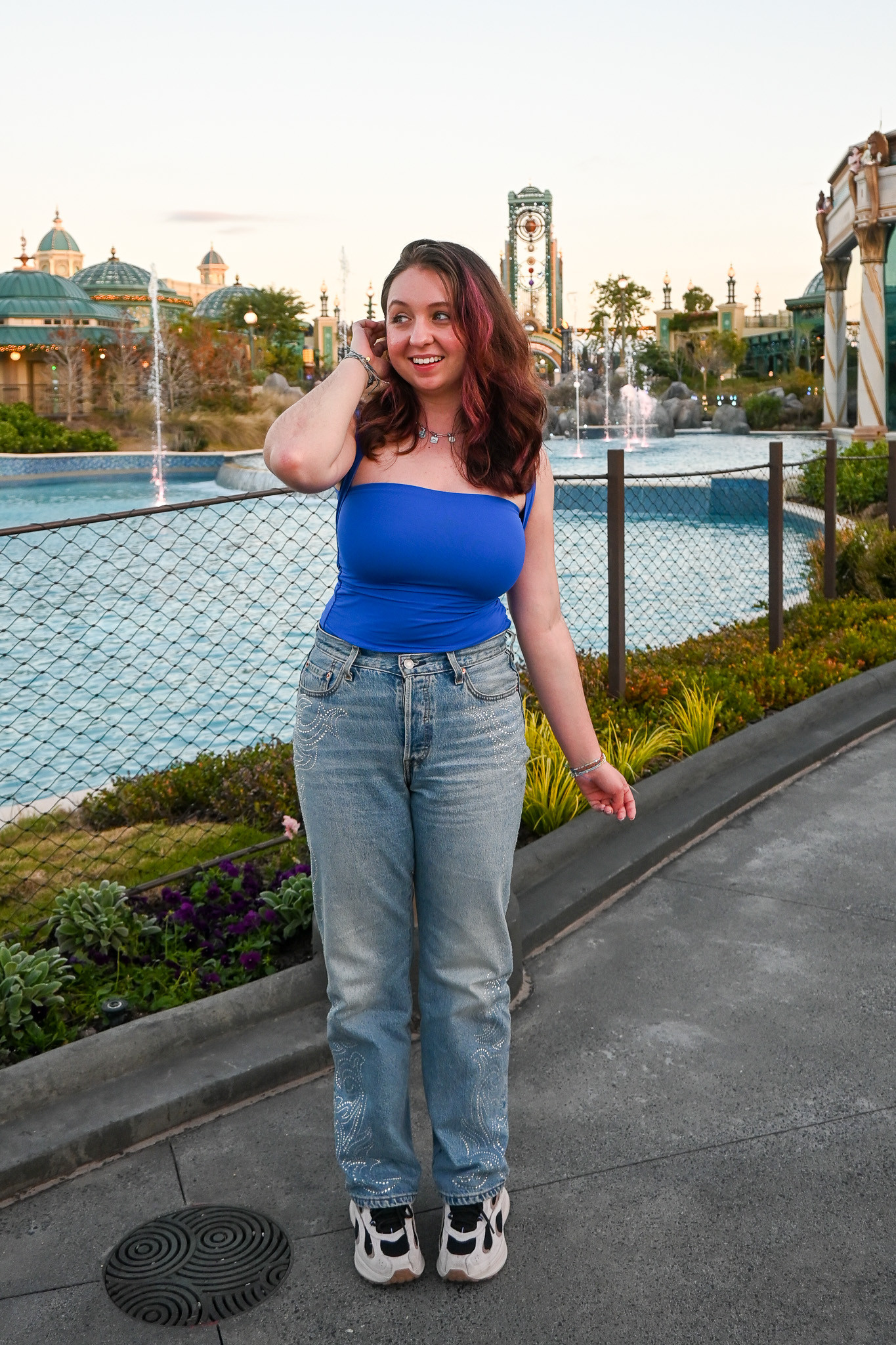 perhaps my favorite Epic Universe outfit - a distincly Universal blue tank with an interesting neckline and sparkly jeans. perfect for a warm florida winter day! 

 