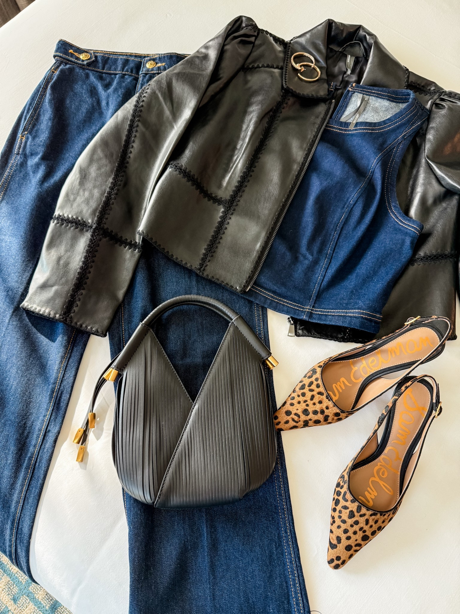 All laid out and ready for a fall night 🍂 Denim on denim with a little edge—leopard heels, a black faux leather jacket, gold hoops, and my favorite fringe bag with just enough shine. Easy pieces that feel pulled together without trying too hard. 


FallStyle
OOTD 
DenimOnDenim
Abercrombie 


#LTKPetite #LTKStyleTip