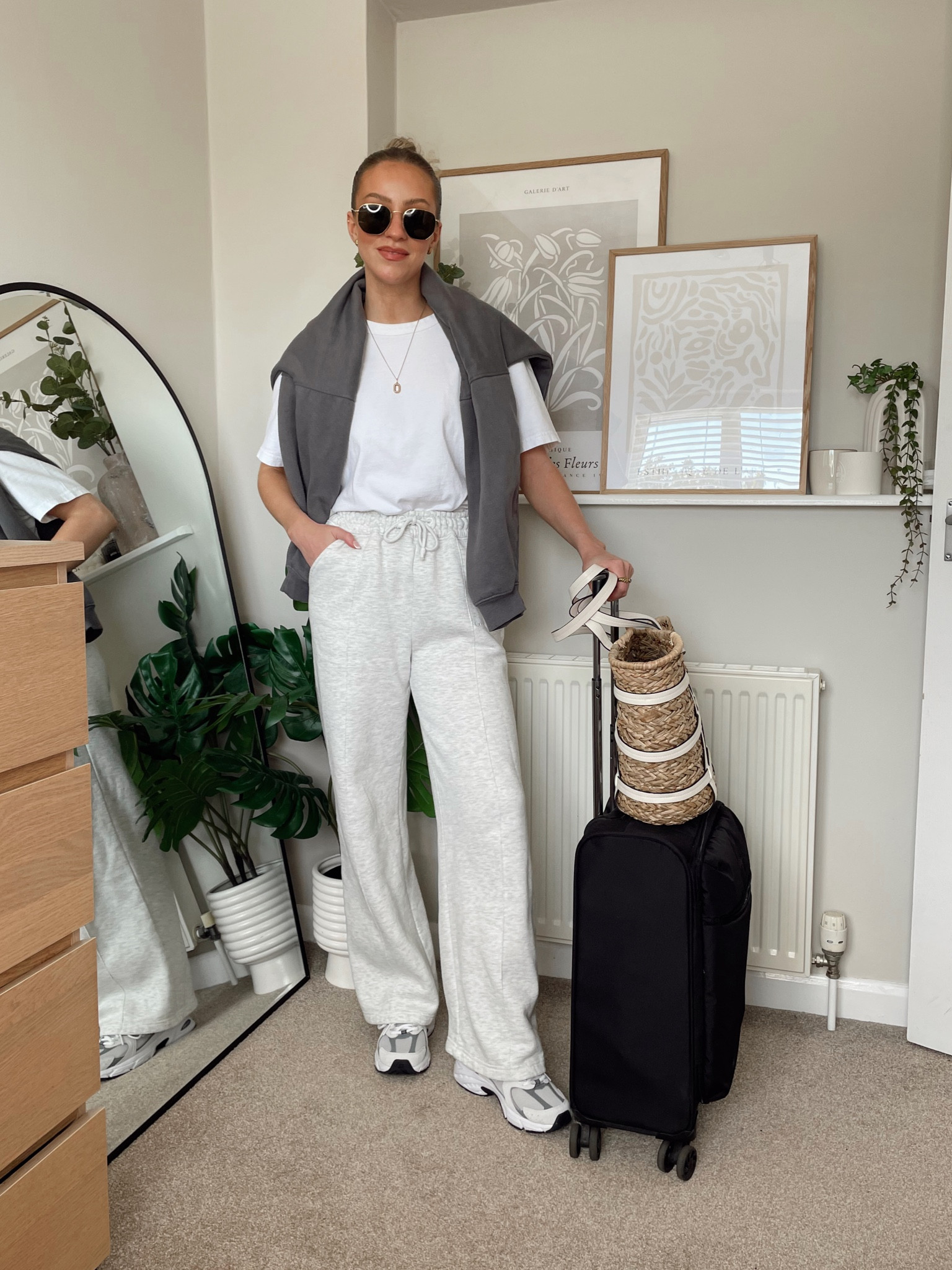 Airport outfit, wide leg joggers, oversized white T-shirt, charcoal sweatshirt, new balance 530s in grey, rayban hexagonal sunglasses

#LTKshoecrush #LTKstyletip #LTKtravel