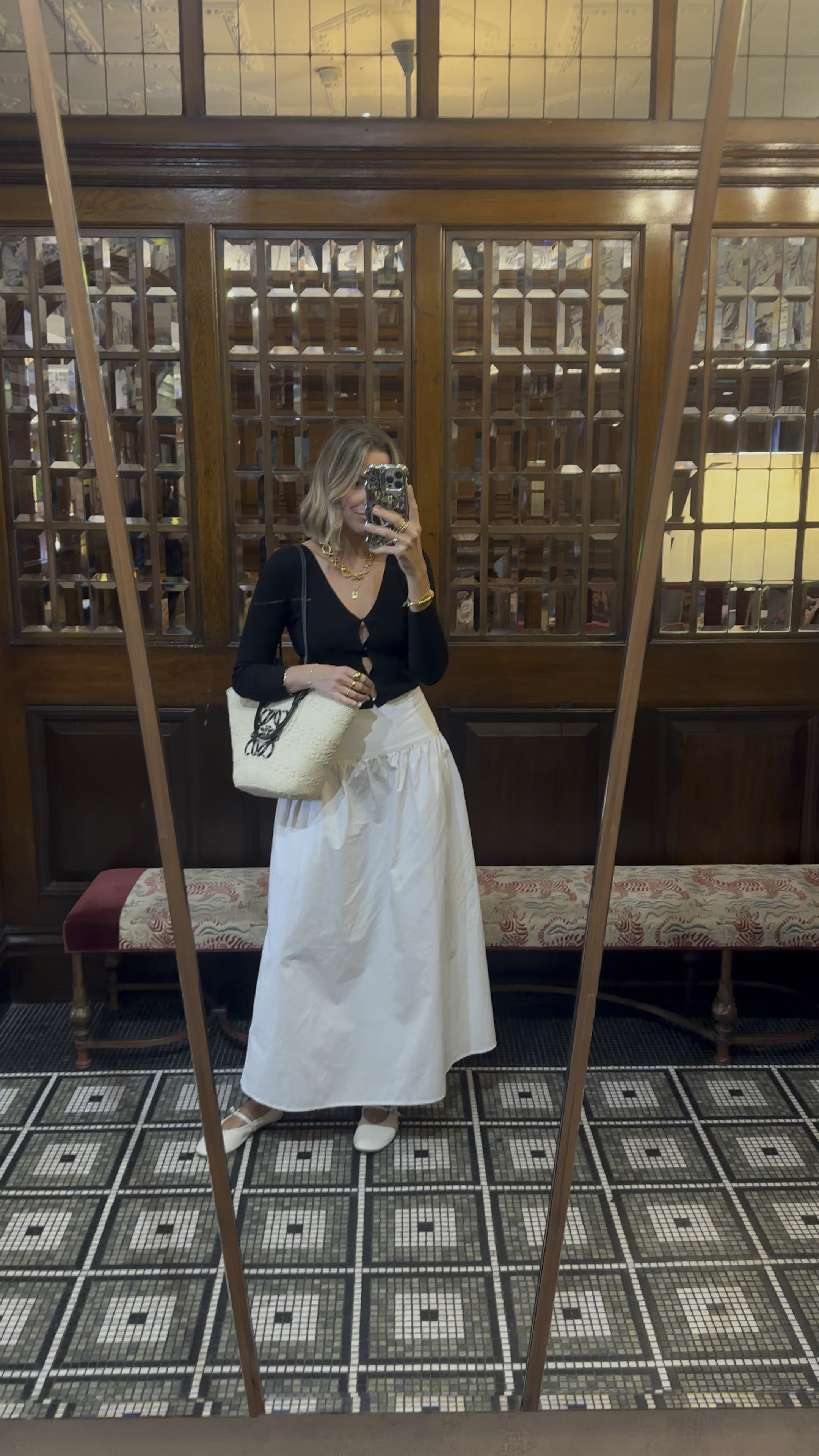 White maxi skirt 
Black cut out cardigan 
Basket bag


#LTKspring #LTKeurope #LTKstyletip