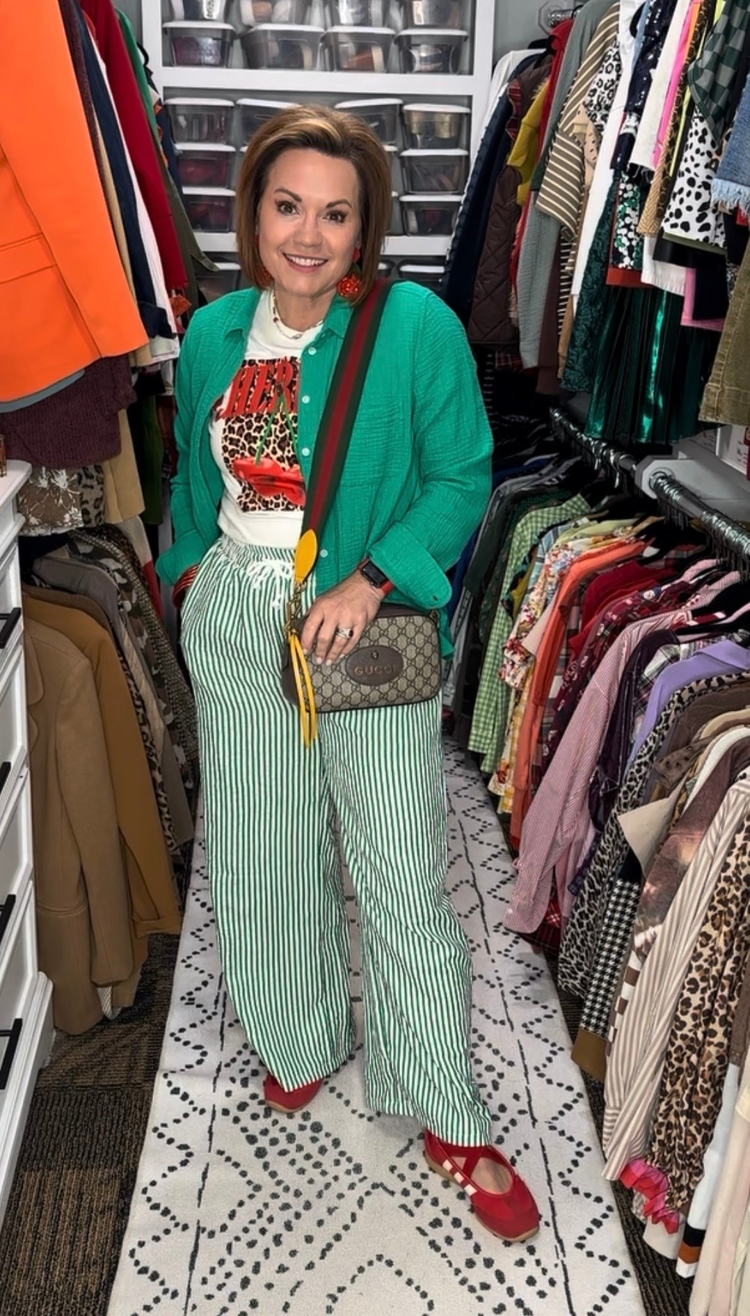 Mixing stripes, leopard, bold color, and red accessories because getting dressed should still feel FUN — even in the middle of busy season. ❤️💚

These green striped wide-leg pants are lightweight, comfy, and make such a statement without sacrificing comfort. I paired them with a graphic tee, layered an oversized green button-down on top, and finished it with bright red Mary Jane shoes and a designer-inspired crossbody for that playful pop of color.

This look feels equal parts comfy, confident, and completely unapologetic… which is exactly the energy I’m bringing into this season of life.

colorful outfit ideas, over 50 fashion, fashion over 50, bold color outfit, striped wide leg pants outfit, green striped pants, red mary jane shoes, graphic tee outfit, layered button down outfit, colorful fashion inspiration, pattern mixing outfit, maximalist fashion, eclectic style outfit, comfy chic outfit, casual summer outfit, vacation style, resort casual outfit, teacher outfit inspiration, midsize fashion inspiration, everyday outfit ideas, casual chic style, statement outfit ideas, playful fashion, ageless style, over 40 fashion blogger, over 50 style influencer, confidence in fashion, fun fashion for women, elevated casual outfit, closet styling inspiration, spring summer outfit ideas, trendy wide leg pants, colorful accessories, red accessories outfit, green and red outfit, fashion reel inspiration, amazon fashion finds, chic comfy outfit, real life fashion inspiration, dopamine dressing, happy outfit ideas, style at any age, fashion for busy women, expressive style, printed tee outfit, women’s casual fashion, standout outfit inspiration, weekend style ideas, bold fashion choices, wearable fashion trends

#LTKootd #LTKOver40 #LTKgrwm