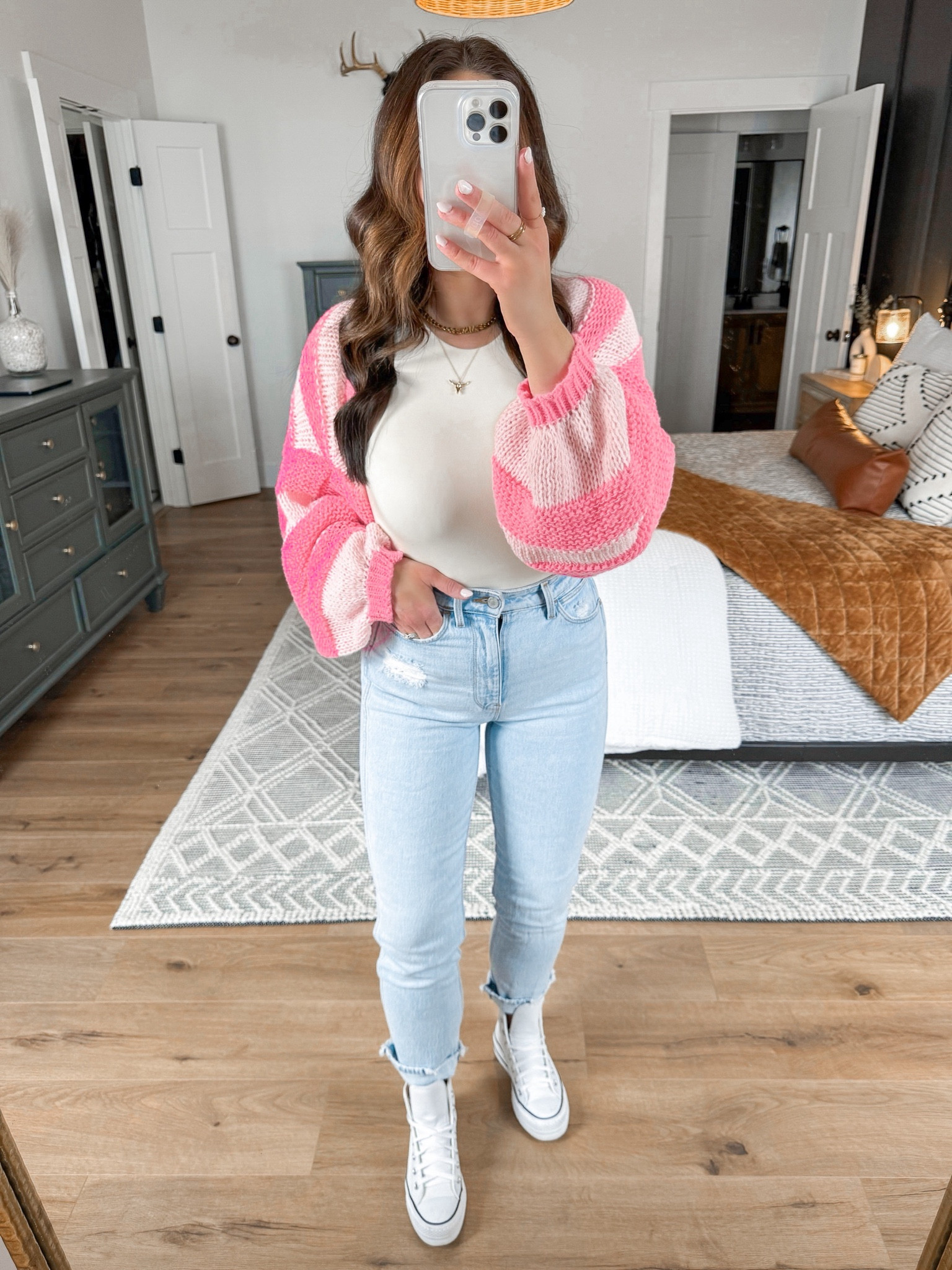 Bodysuit — small
Shrug — medium (sized up one for an oversized fit)
Jeans — 4

Easter outfit ideas | easter outfits | easter style | striped sweater shrug | light wash wrangler mom jeans | white leather platform converse sneakers outfit | mom jeans | spring fashion | spring outfits | spring style | spring sweater 