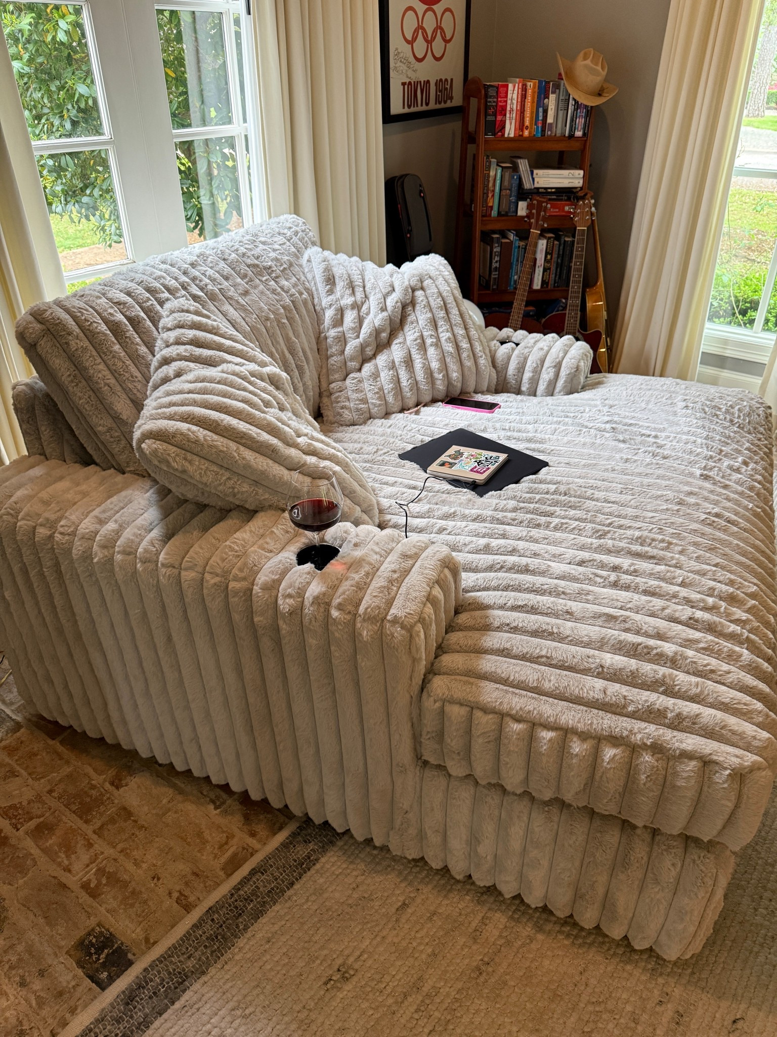 The besttttttt oversized chaise lounge reading chair ever! Has power for charging your phone or kindle plus cup/wine holders!