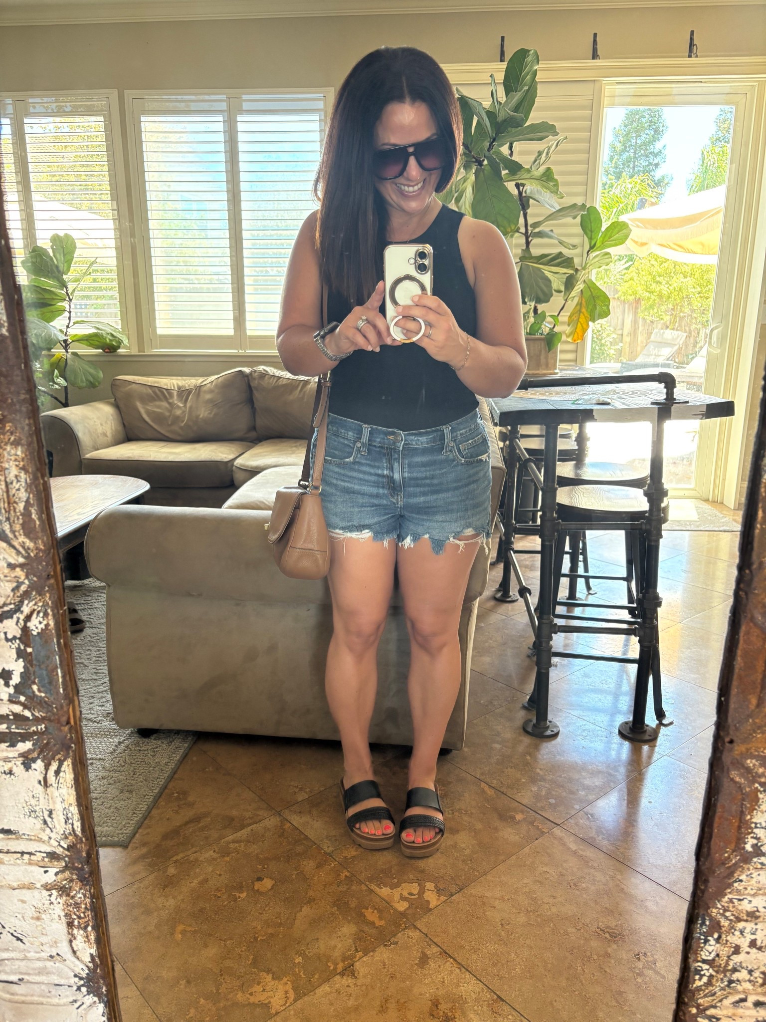Sunday Funday has a whole different meaning when you’re in your 40s, married, and parenting teens/preteens! Today is shopping with the kids, getting them treats, and being the chauffeur. I read that distressed denim is out, but I’m still wearing these shorts that I have in 3 washes, wearing small. My tank is under $4, I snagged 4 of them, wearing medium. 

Weekend look
Mom style 

#LTKSeasonal #LTKPetite #LTKOver40