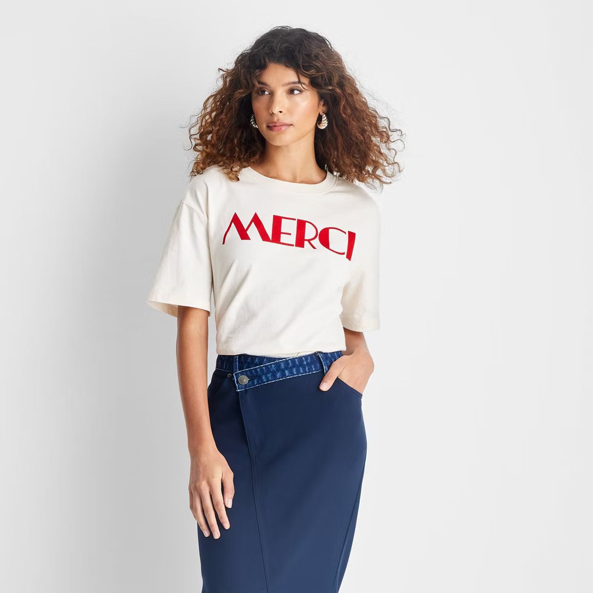 Women's Short Sleeve 'Merci' Graphic T-Shirt - Future Collective Off-White | Target