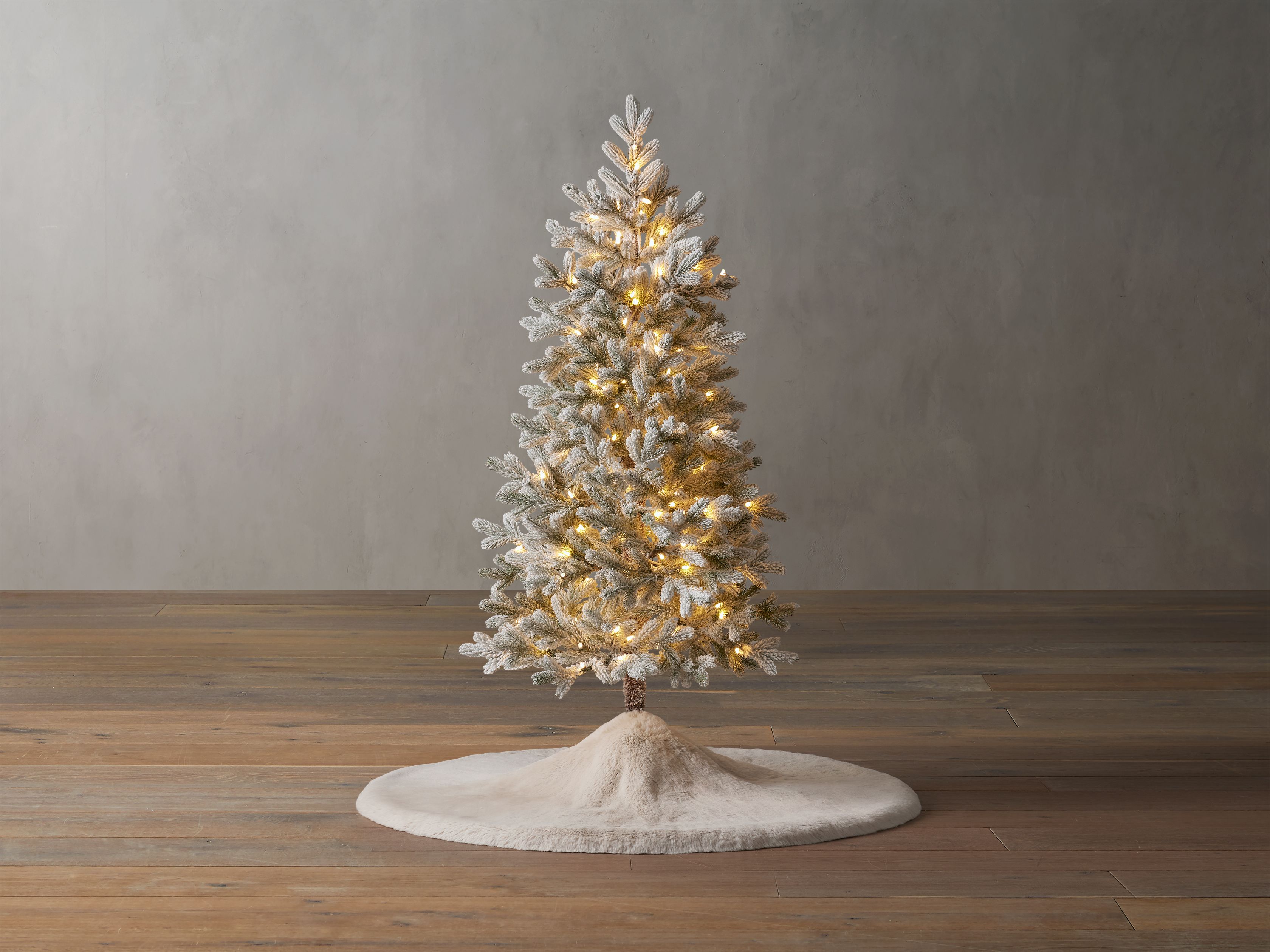 Deck the halls—or living rooms or foyers—with our charming collection of lighted faux trees. ... | Arhaus