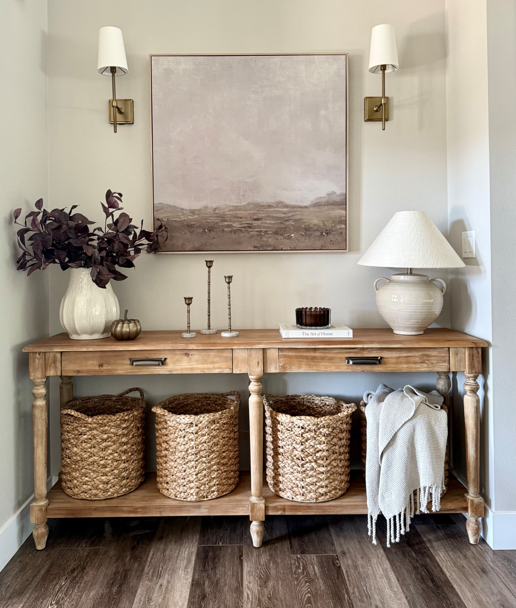 Fall in my foyer 

World market / Everett table / console table / natural organic / baskets / lamp / lampshade / vase / ceramic / candle holders / tapers / candlesticks / fall stems / floral / plum stems / books / candle / autumn decor / fall decor / wall sconces / wall art / Target finds / throw blanket / agreeable gray / modern organic 

#LTKSeasonal #LTKFindsUnder100 #LTKHome