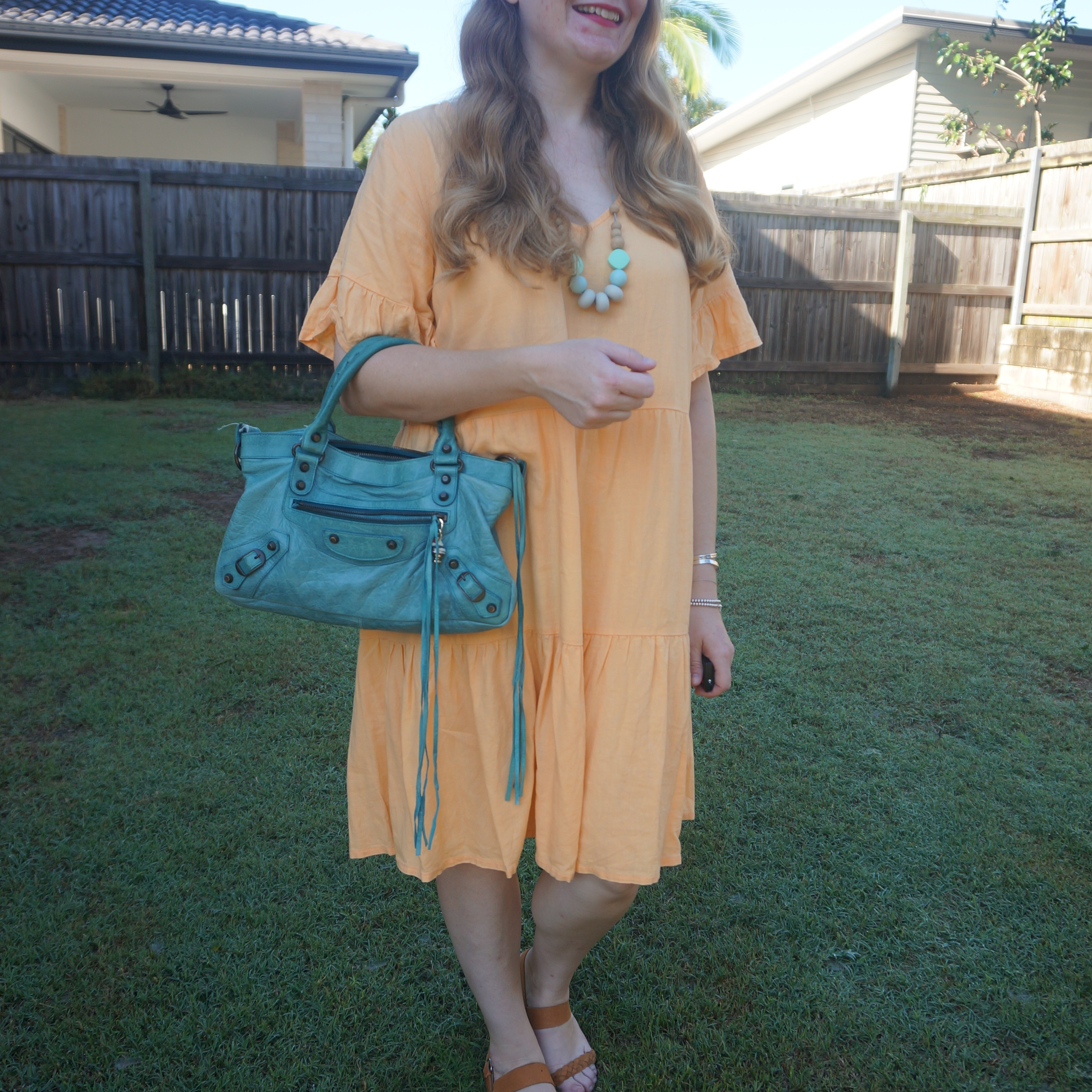 Kmart Anko tiered yellow linen dress with a pop of colour from the turquoise Balenciaga first bag 💛💙

#LTKbag #LTKdresses #LTKaustralia