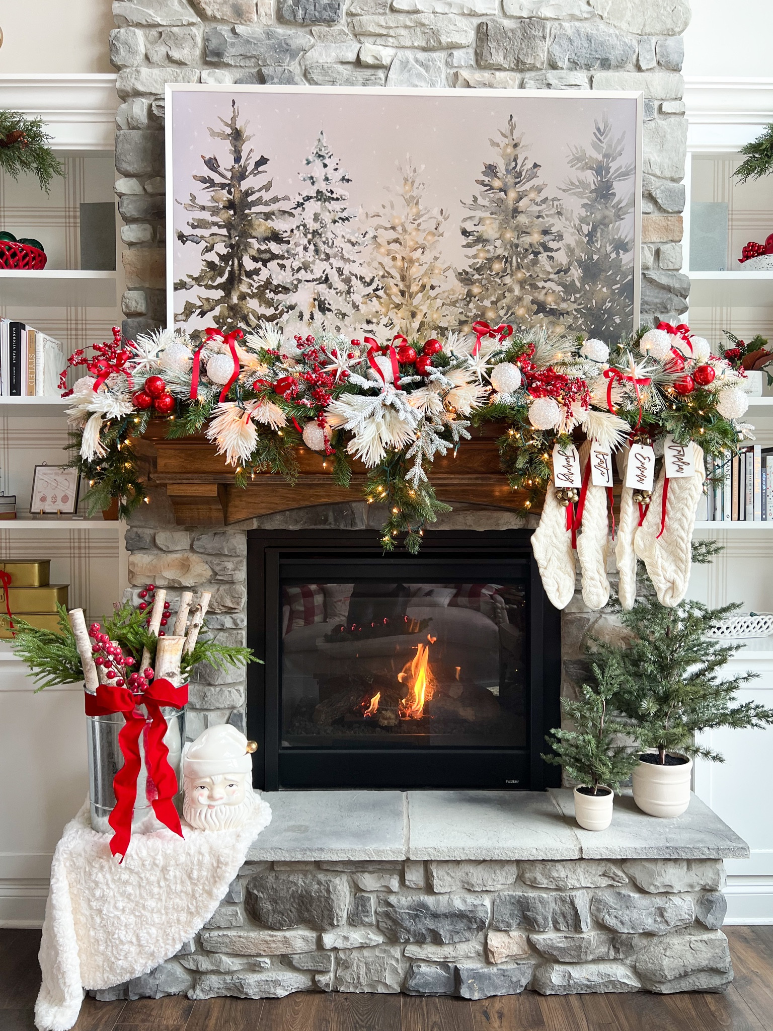 Everything you need to recreate my holiday mantel garland! This garland went down as one of my most favorite ever. Here are the estimated quantities of each item that I recommend :

Cascading Garland: 1 
Flocked Stems: 4 of each style
Red Berry Stems: 4 
White Ornaments: 12
Red Ornaments: 12 (display as clusters of 3)
White Star Ornaments: 4
Red Ribbon: 1 spool (tied into 6 small bows throughout the garland) 
Lights: 1 strand of the “clear twinkle” color for a little sparkle

I’m also linking our exact stockings, name tags and a similar set of gold bells that I hang with the name tags  

#LTKSeasonal #LTKHome