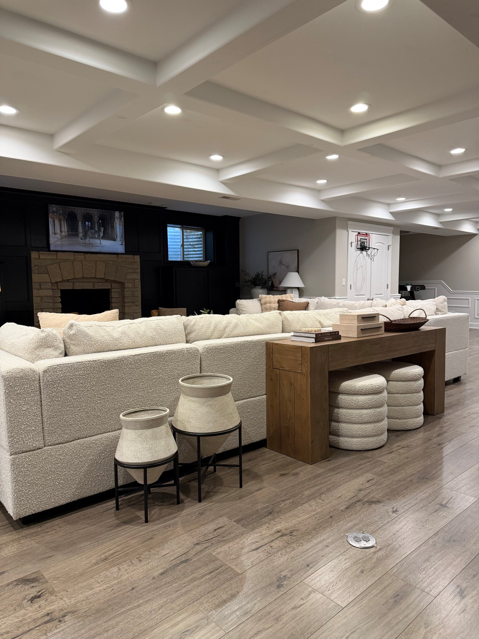 A cozy view of our basement sitting area 🤍

I love adding a console table behind the sofa for styling space and extra storage. The layered textures, neutral decor, and boucle seating make this room feel warm and inviting.

#LTKHome