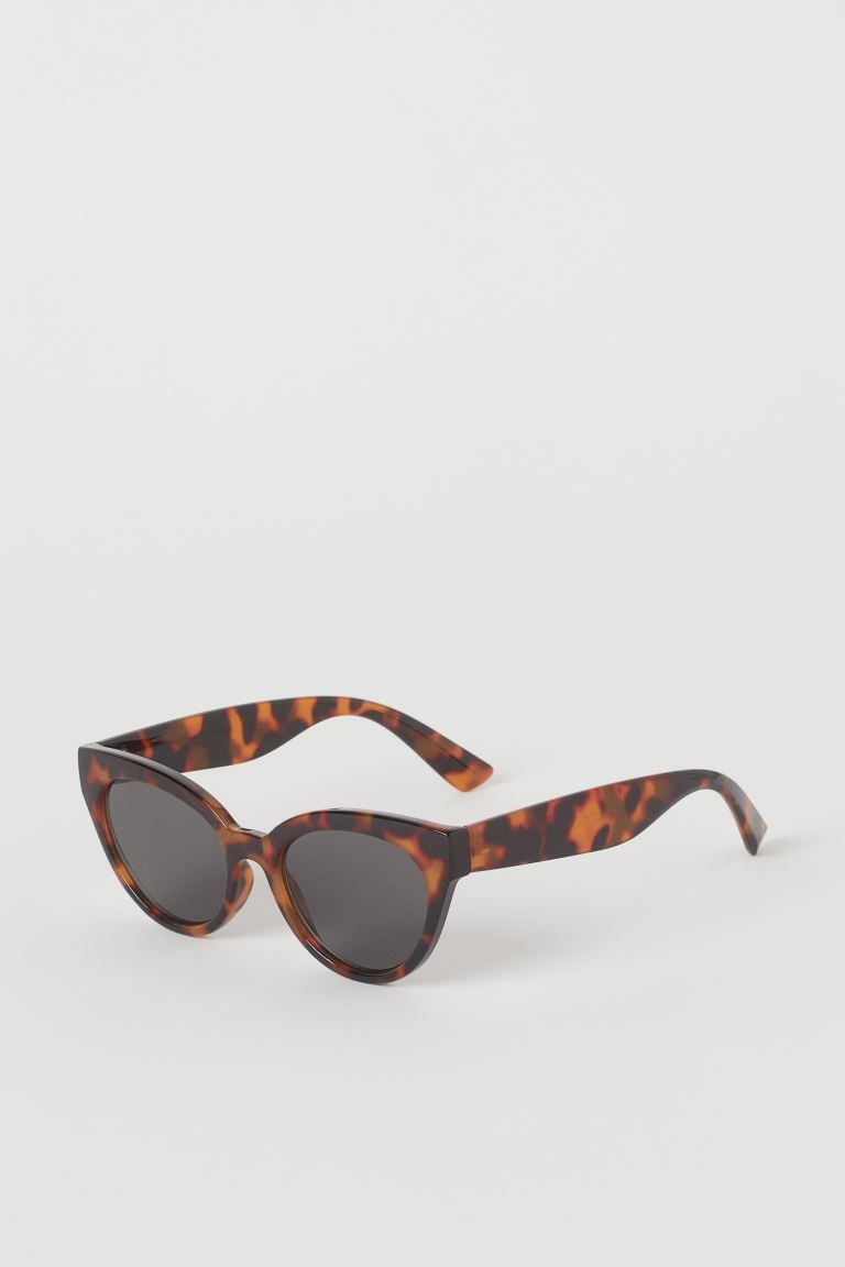 Cat eye sunglasses with plastic frames and tinted, UV-protective lenses. | H&M (US + CA)