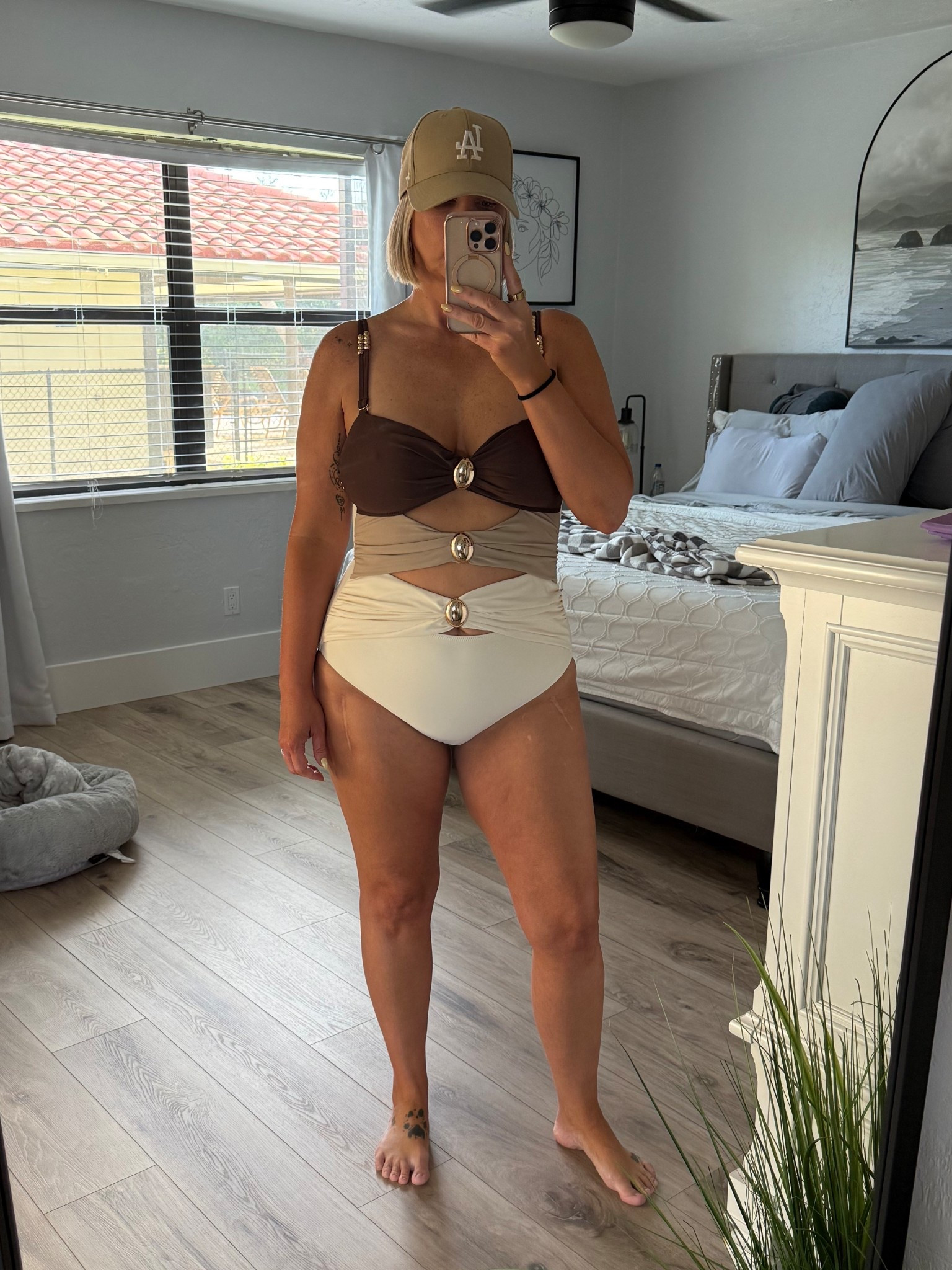 Kinda obsessed with suit! The peekaboo cut outs with the gold details really make this suit feel elevated. Fits tts I’m wearing a large. 

Budget friendly suits, resort style, elevated swimwear, 

#LTKFindsUnder50 #LTKSwim #LTKMidsize