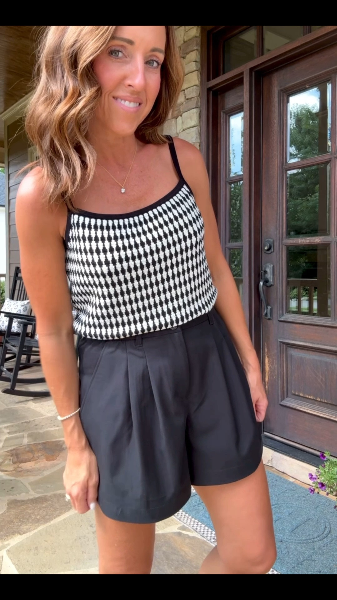 Black & white sweater tank. Pleated black shorts. 
Both XS.

#LTKootd #LTKSeasonal #LTKOver40