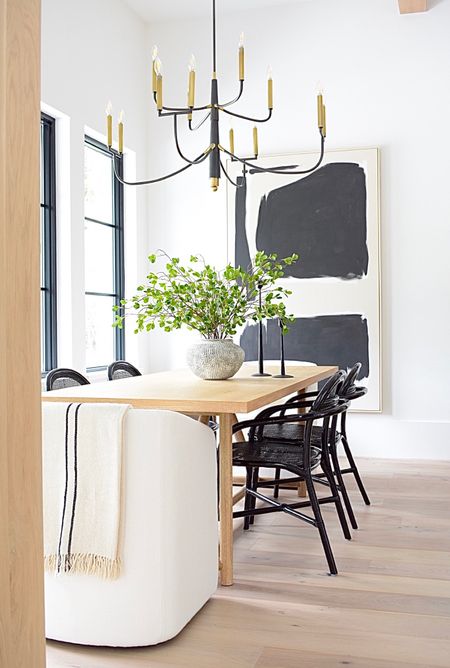 Loved the simplicity of our light filled dining room in our previous home🤍

Dining room, dining chair, dining table, over sauced canvas art, black and brass chandelier, gray vase, faux stem, faux branches 

#LTKSeasonal #LTKstyletip #LTKhome