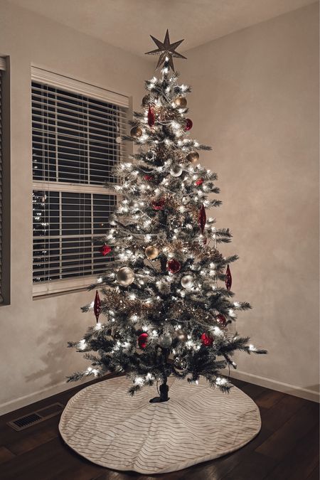 Classic Christmas tree all from target holiday section. 7 foot flocked pre lit tree with red, gold, and silver ornaments  

#LTKSeasonal #LTKHoliday #LTKGiftGuide