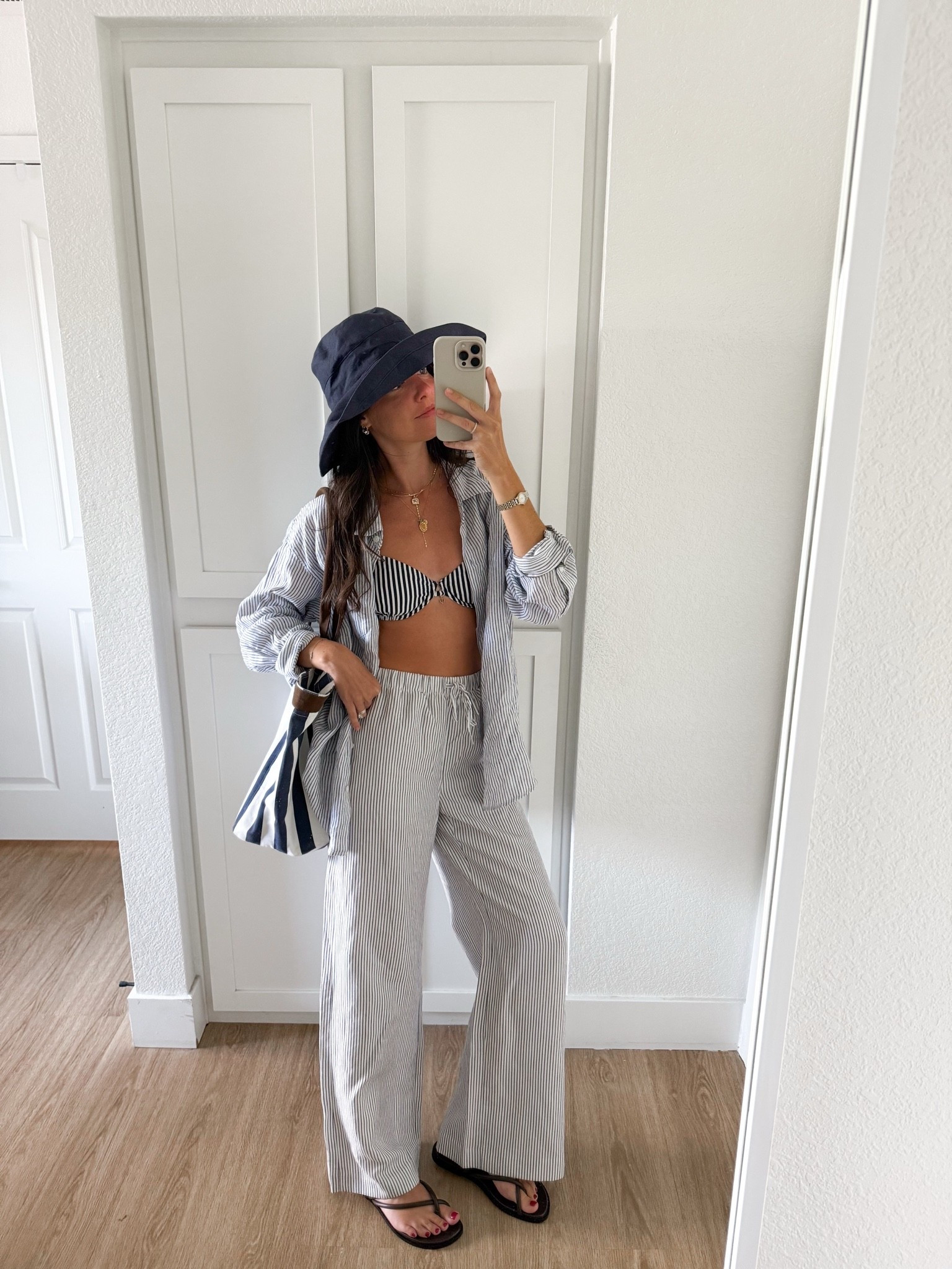 I am 5’7 wearing size small in the pants and button down, and XS in the bikini!