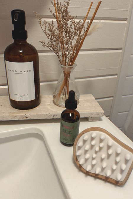On/before hair washing day, I apply this rosemary mint hair oil to my scalp and massage it in with the brush to stimulate the scalp for hair growth. Then I’ll either wash it out right away or slick my hair back in a bun for the day and wash it at night! 

#LTKhome #LTKbeauty #LTKfindsunder50