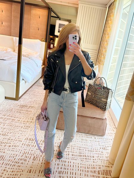 Today's travel look- love this leather moto jacket so much- cropped fit is so good. Wearing xs and jeans run true to size shoes are chanel

#LTKover40 #LTKfindsunder100 #LTKtravel