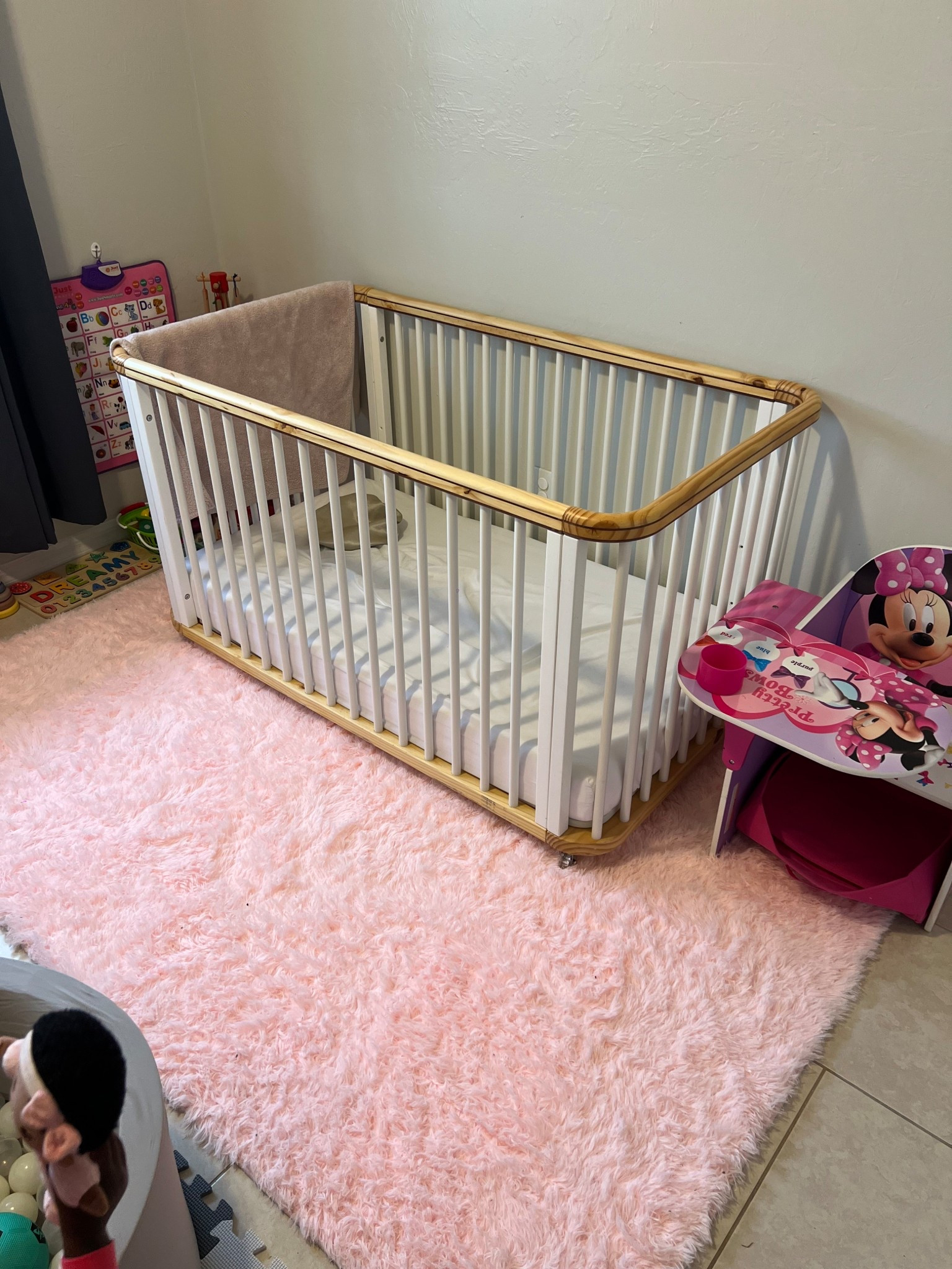 This pink carpet adds a great touch but the Nestig Cloud Crib was great investment it’s  a 3-in-1 convertible crib that transforms from a mini crib (bassinet) to a full crib and then to a toddler bed! 

#LTKKids #LTKFamily #LTKBaby