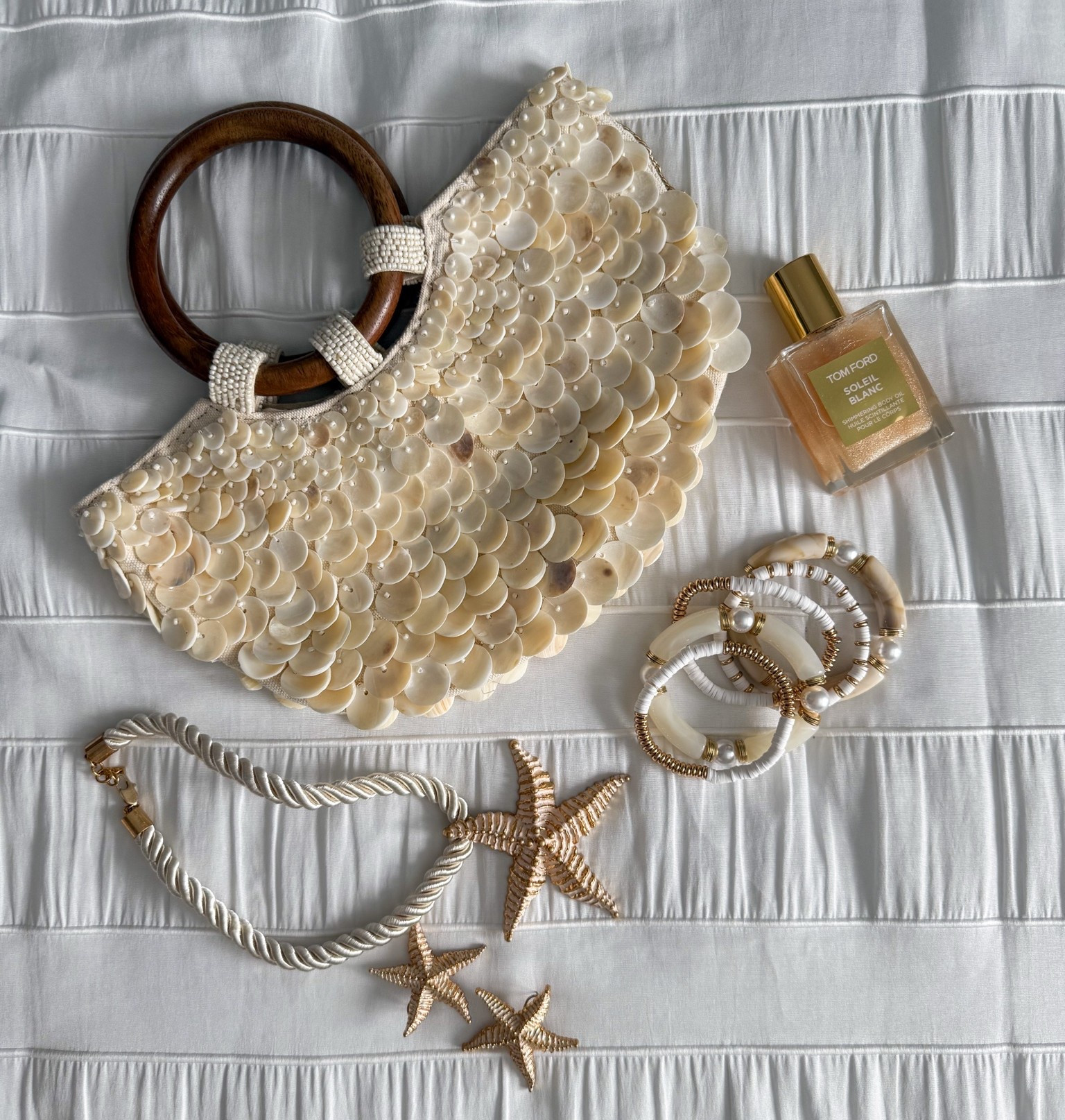Beach accessories, shell bag, bracelets, beach jewelry, starfish, shimmer oil, beach beauty

#LTKSwim #LTKTravel #LTKBeauty