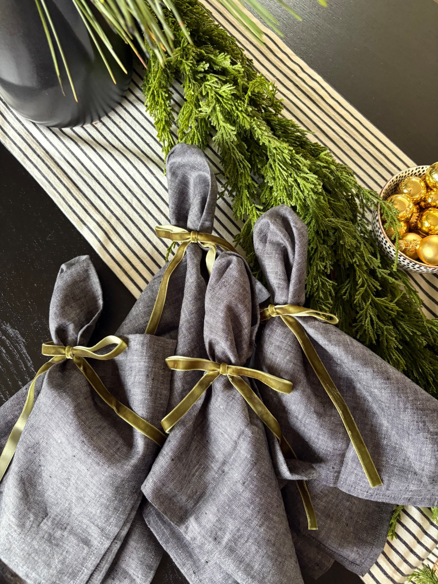 Simple holiday table setting with linen napkins tied with premade velvet ribbon bows. Easy and classic! 

#LTKHoliday #LTKHome #LTKSeasonal