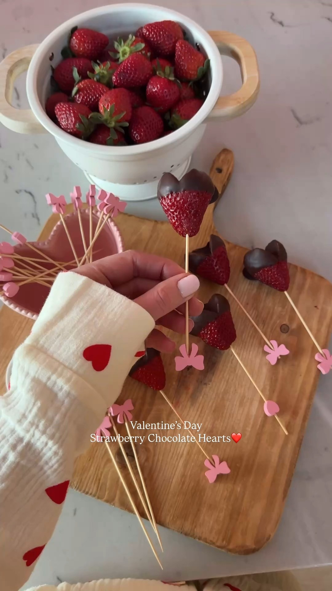 Valentine’s Day Strawberry Chocolate Hearts❤️🍓🍫Such a fun sweet treat from February! Here’s how I make them!👩🏻‍🍳
+ cut a triangle shape out of the top of the strawberry🍓
+ melt 1 cup of dark chocolate chips & 1 tablespoon of coconut oil🍫
+ dip the strawberry in the chocolate mixture and place on parchment paper 
+ put in the fridge to set for 30 min
ENJOY!🤤❤️🍫

#LTKfoodie #LTKValentine #LTKHome