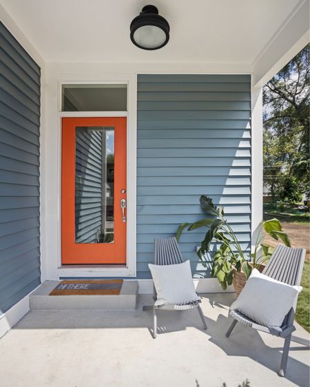 A bright pop of color on the front door draws attention and feels welcoming to guests .

#LTKhome