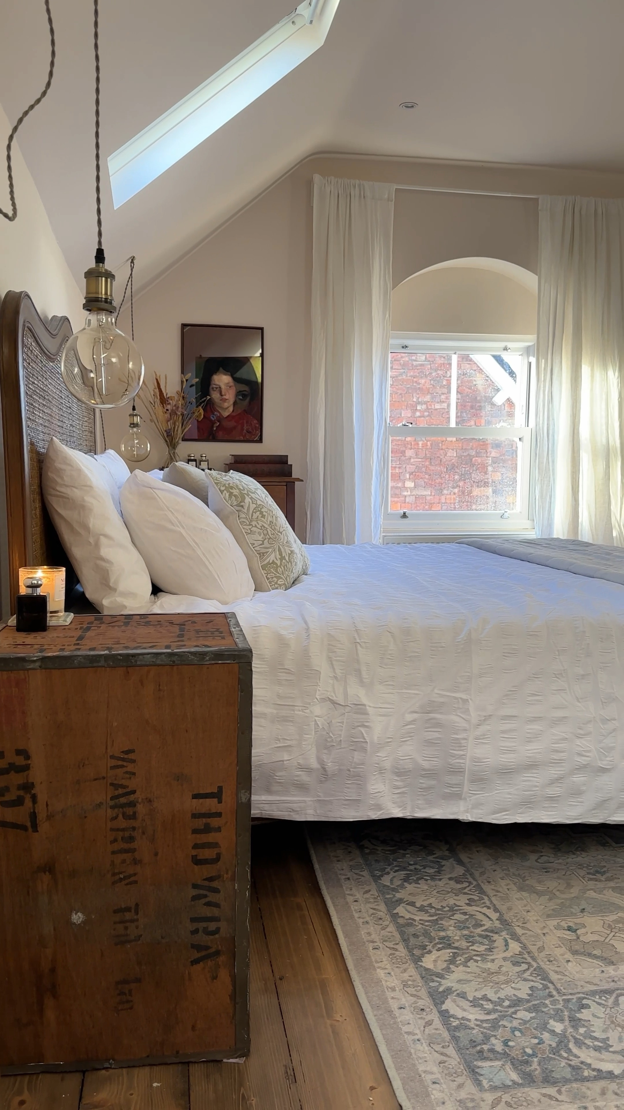 Pink master attic bedroom. 

Vintage style rattan bed, tea chest bedside tables, large washable rug, linen voile curtains and white bedding. 

#LTKeurope #LTKhome