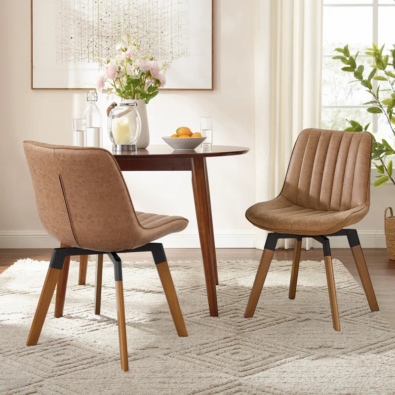 Bishaan Tufted Faux Leather Upholstered Swivel Dining Side Chair (Set of 2) | Wayfair North America