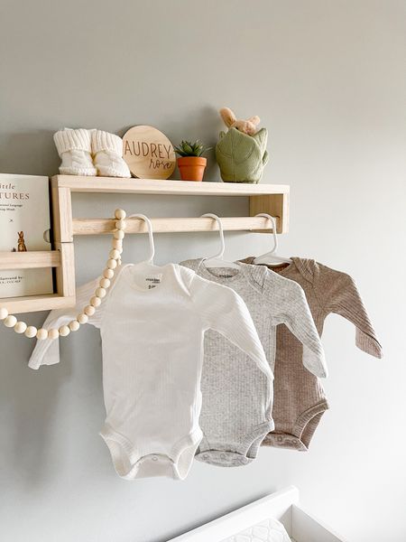 I hung one wooden bookshelf upside down so I could display some of her baby clothes. Baby girl nursery. Neutral nursery. 


#LTKbaby #LTKhome #LTKunder50