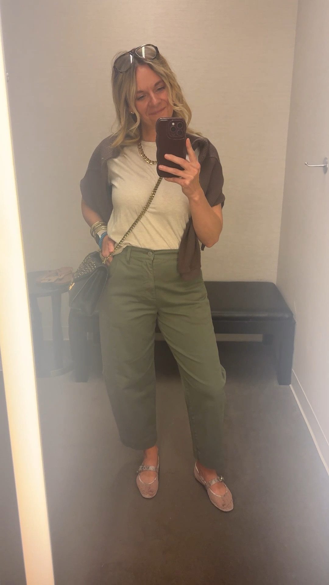 OOTD while setting up a dressing room for a client appointment ✨ Boxy neutral tee + olive barrel pants + brown waffle knit draped over the shoulders + mesh flats + gold accessories. All from my own closet — linked the exact pieces where I can and the closest versions where I can’t. Everything shoppable below! 👇

#LTKOver40 #LTKdayinmylife #LTKootd
